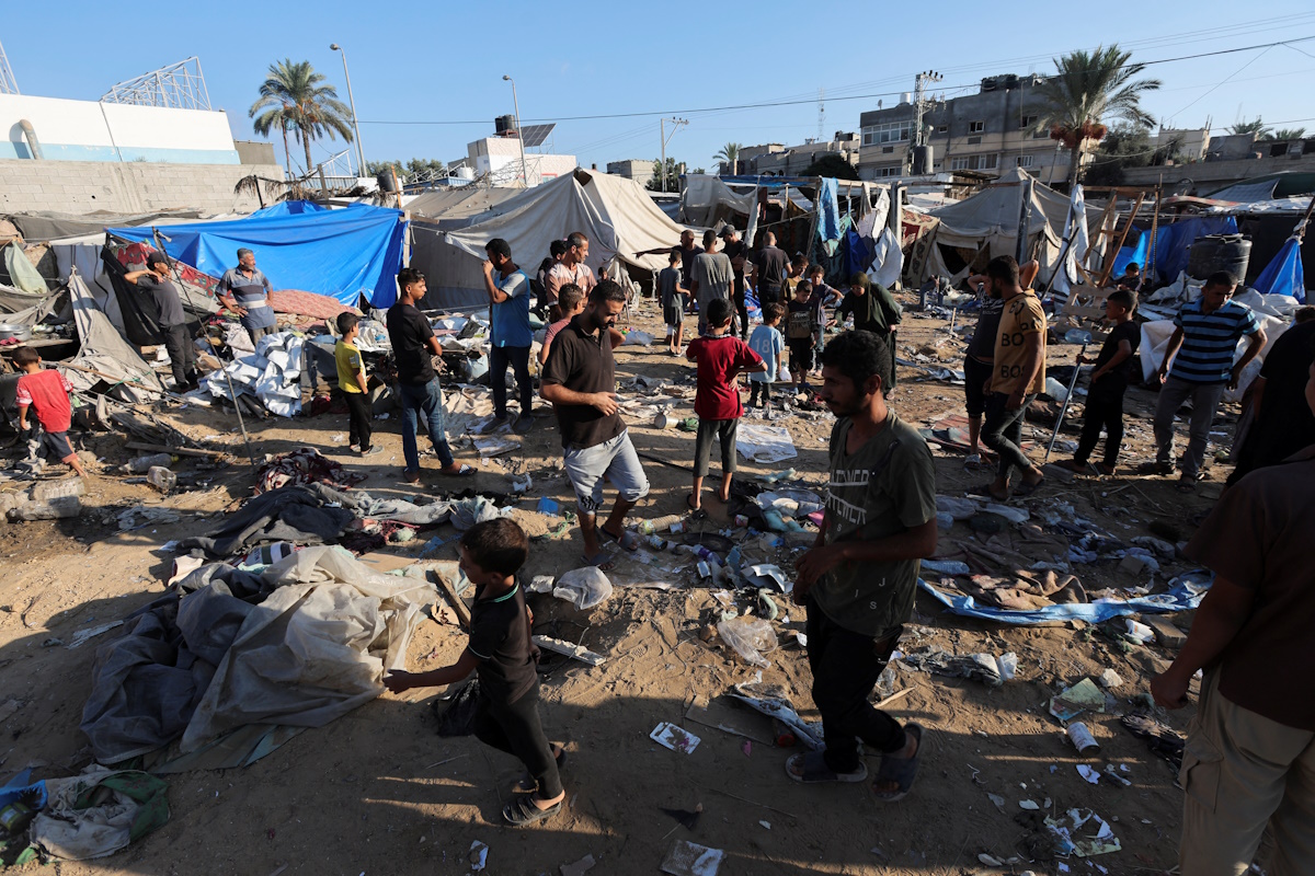 Palestinians inspect the site of an Israeli strike on the courtyard of Al-Aqsa Martyrs hospital, where displaced people were taking shelter in tents, amid the Israel-Hamas conflict, in Deir Al-Balah in the central Gaza Strip, September 5, 2024. REUTERS