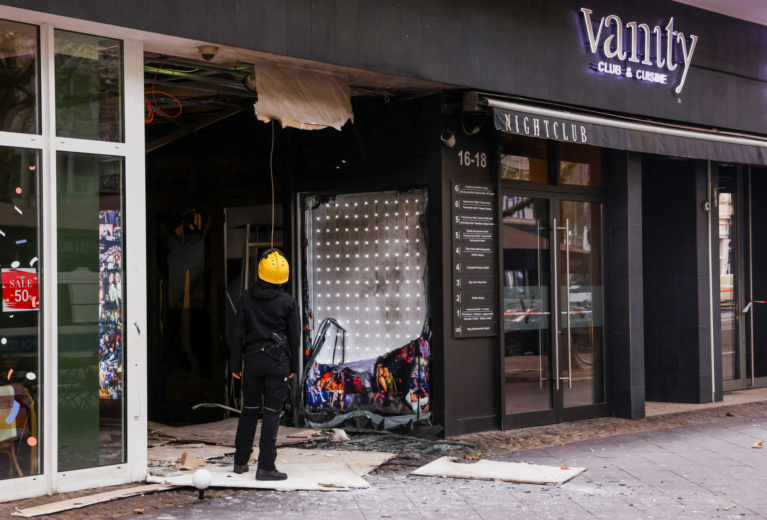 A member of the police looks at the damage after an explosion near the Vanity Club in central Cologne, Germany, September 16, 2024. REUTERS