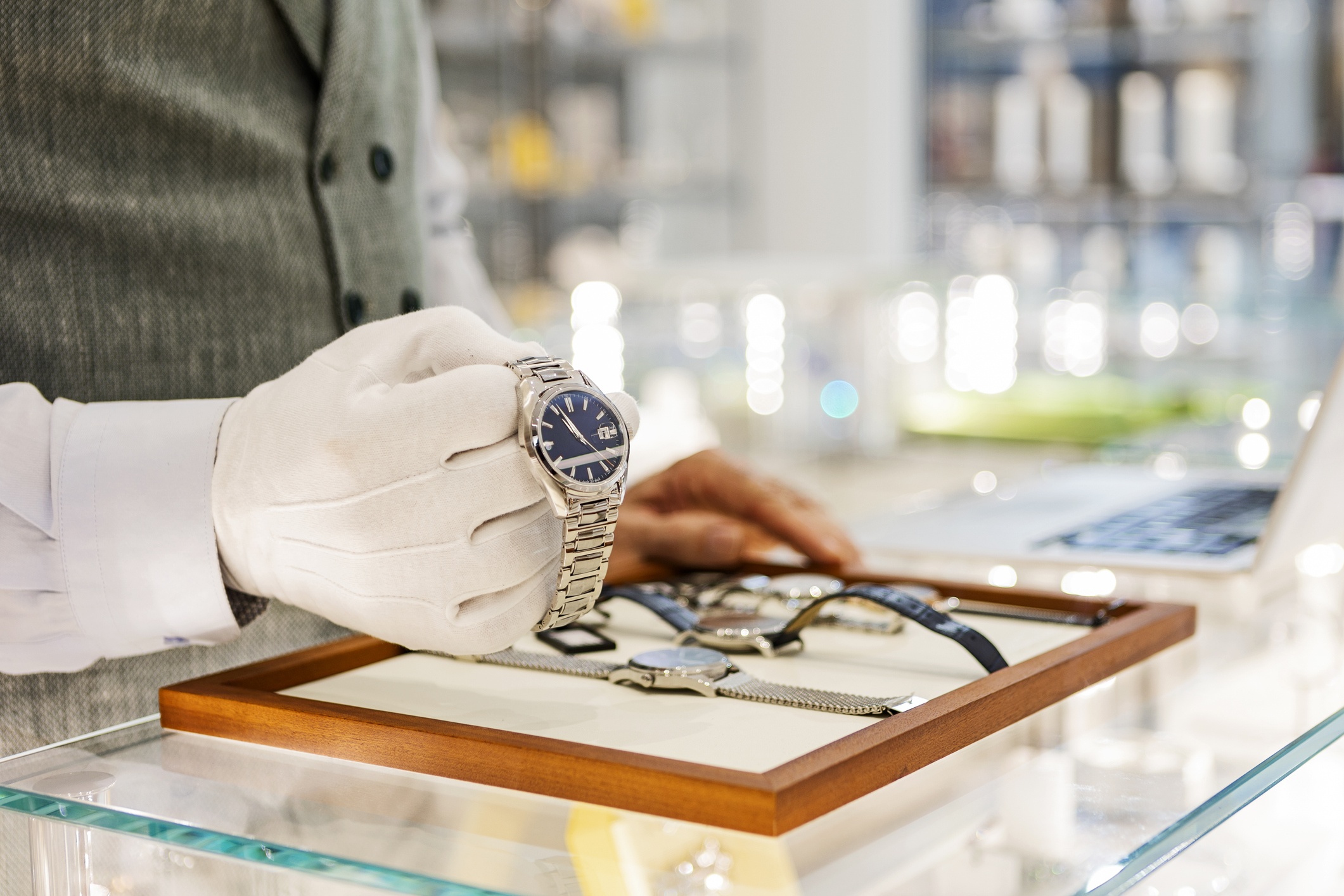 Senior man in jewelry store selling luxury watches