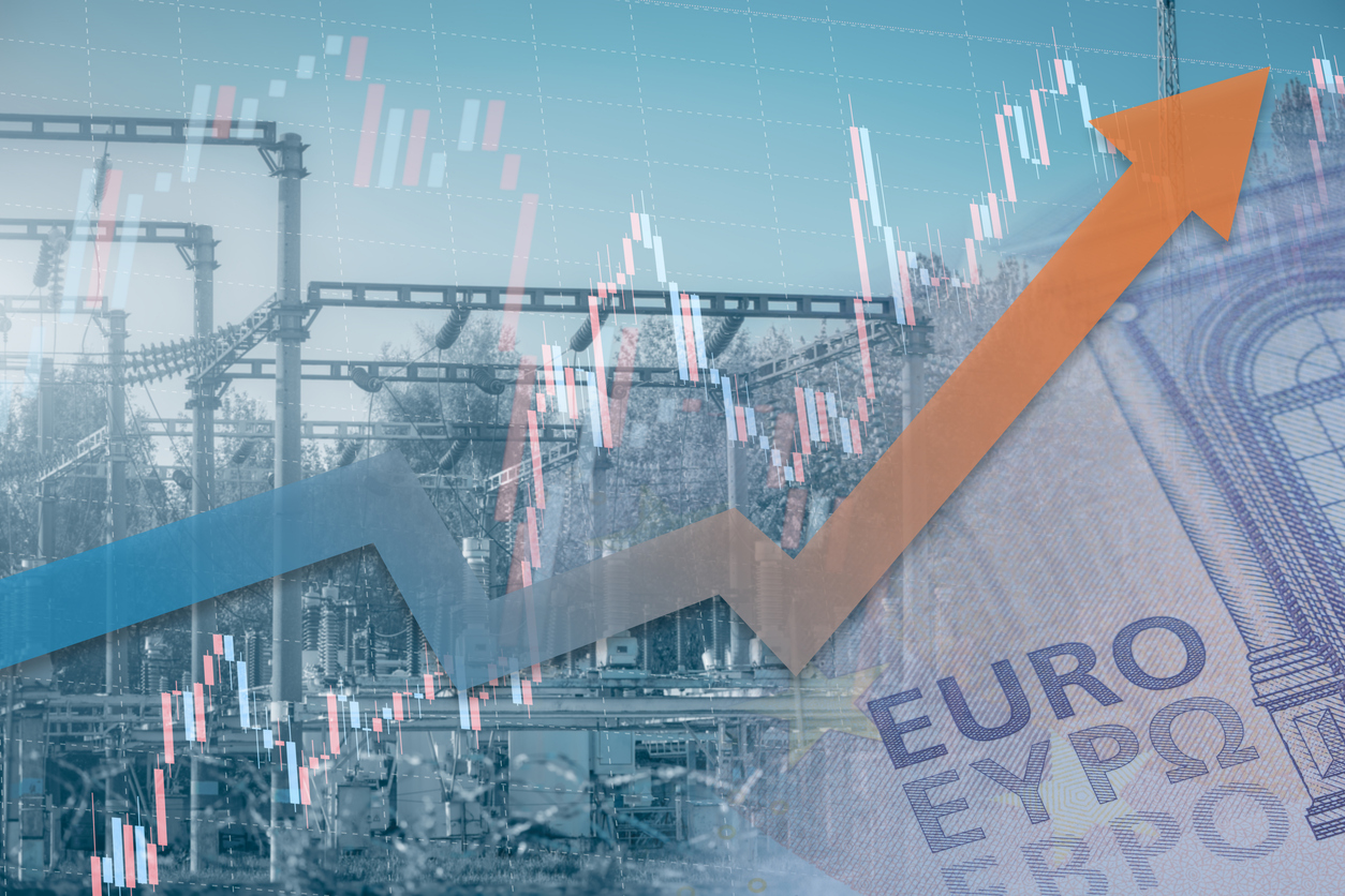 Stock chart with rising up arrow and blurred power station at background. Energy crisis in Europe. Price increase of electricity for home heating and industry.