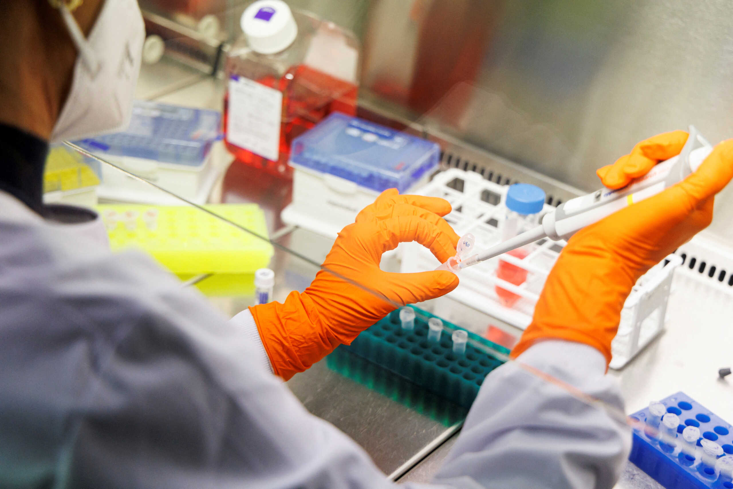 FILE PHOTO: An employee of the vaccine company Bavarian Nordic works in a laboratory of the company in Martinsried near Munich, Germany, May 24, 2022. REUTERS