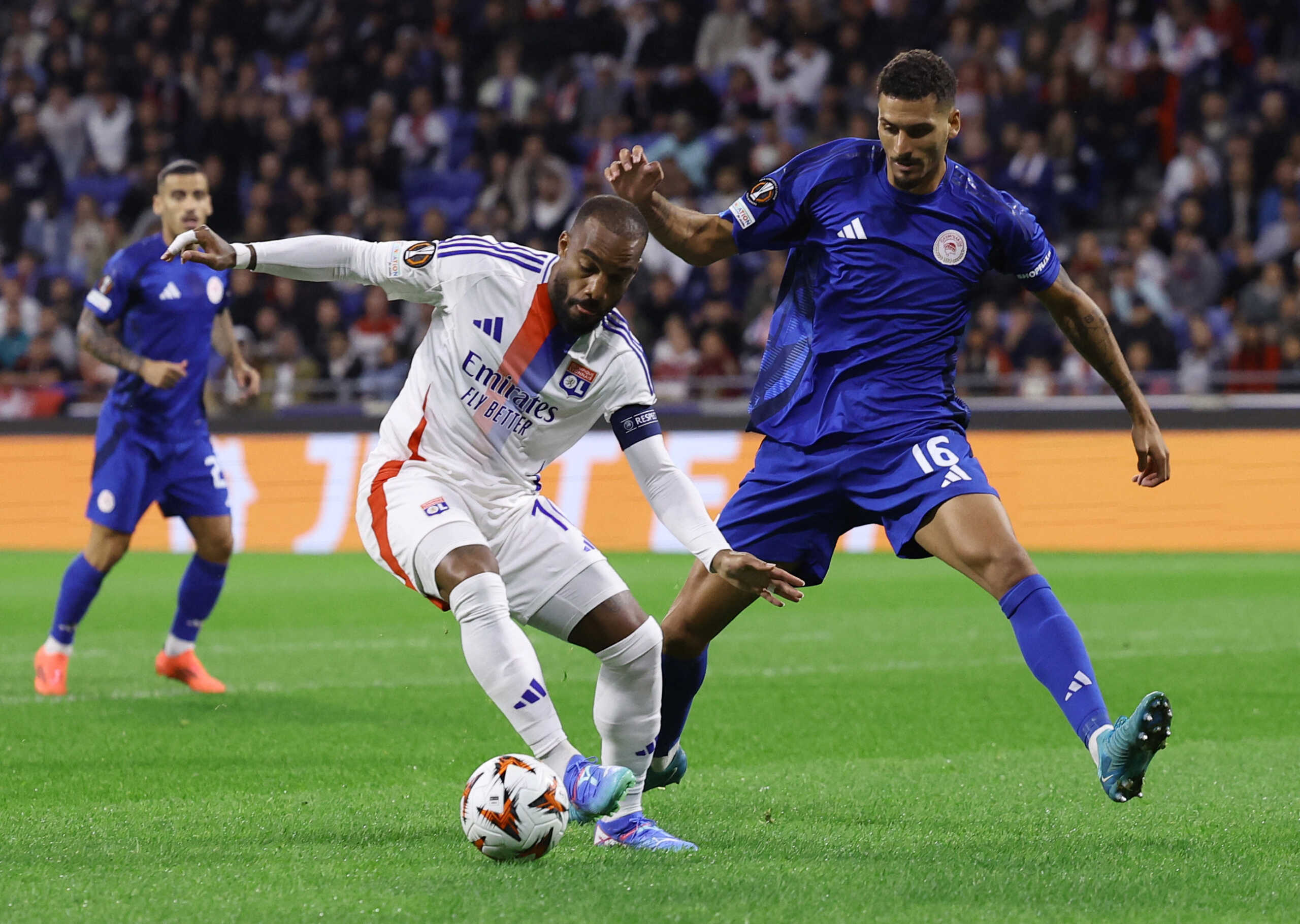 Soccer Football - Europa League - Olympique Lyonnais v Olympiacos - Groupama Stadium, Lyon, France - September 26, 2024 Olympique Lyonnais' Alexandre Lacazette in action with Olympiacos' David Carmo REUTERS