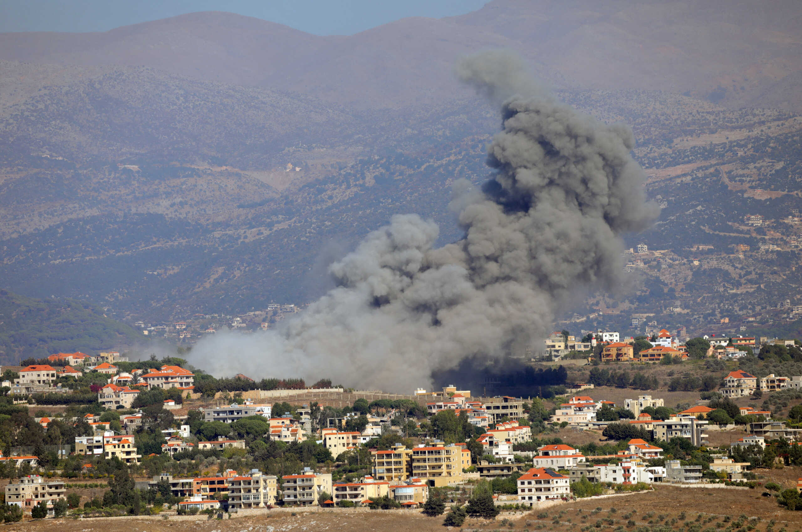 Smoke billows over Khiam, amid ongoing cross-border hostilities between Hezbollah and Israeli forces, as seen from Marjayoun, near the border with Israel, September 25, 2024. REUTERS