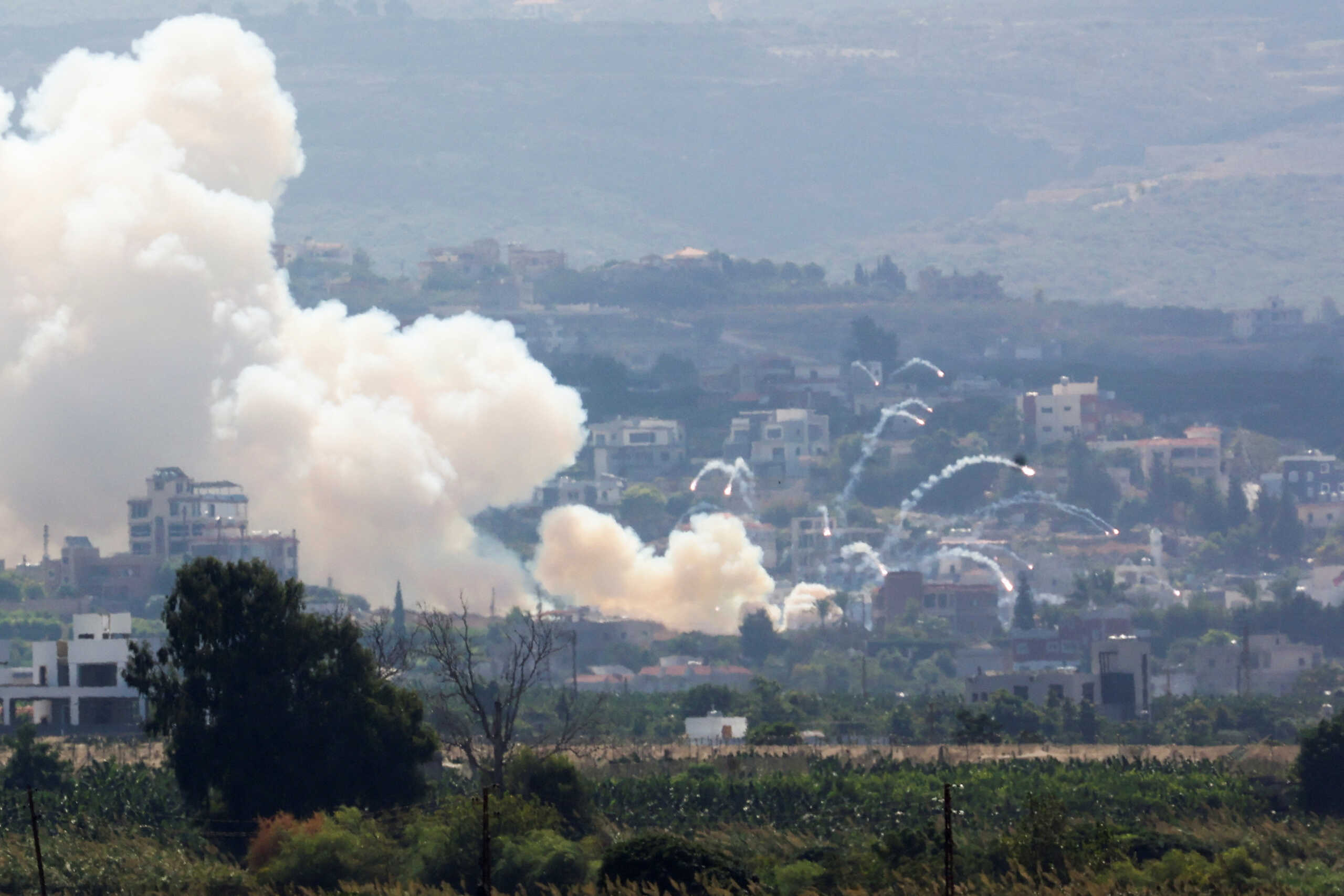 Smoke billows over southern Lebanon following Israeli strikes, amid ongoing cross-border hostilities between Hezbollah and Israeli forces, as seen from Tyre, southern Lebanon September 23, 2024 REUTERS