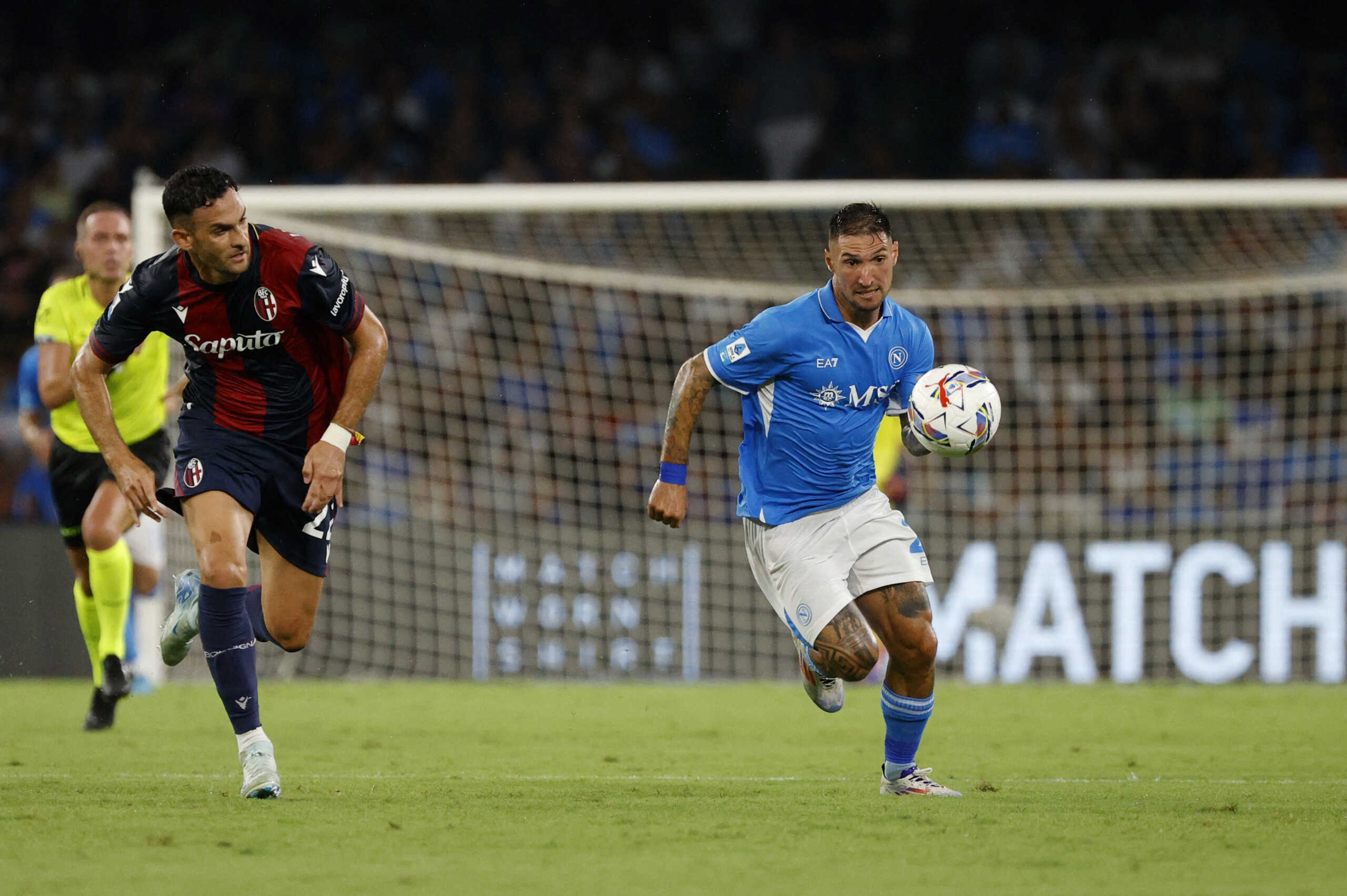 Soccer Football - Serie A - Napoli v Bologna - Stadio Diego Armando Maradona, Naples, Italy - August 25, 2024 Napoli's Matteo Politano in action with Bologna's Charalampos Lykogiannis REUTERS