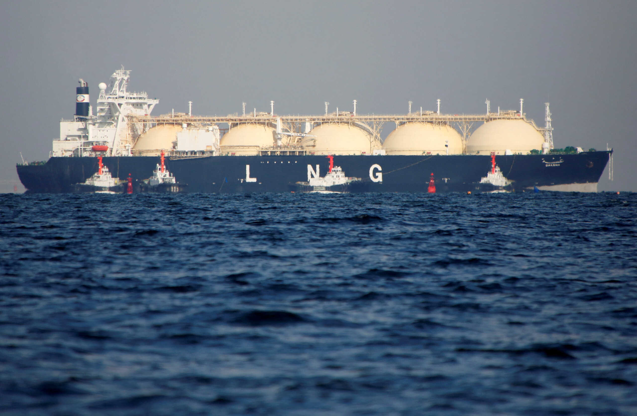 FILE PHOTO: A liquefied natural gas (LNG) tanker is tugged towards a thermal power station in Futtsu, east of Tokyo, Japan November 13, 2017. REUTERS