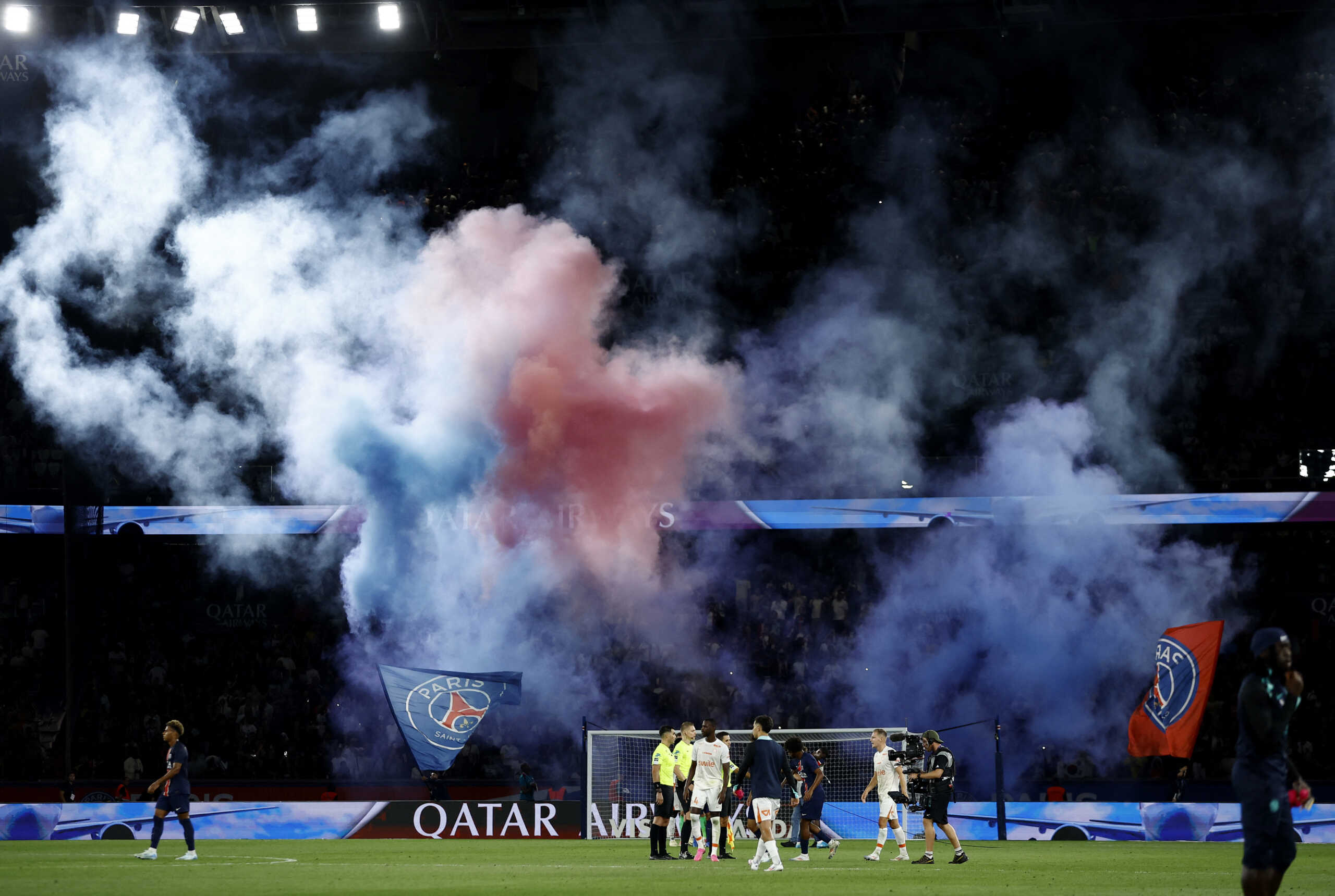 Soccer Football - Ligue 1 - Paris St Germain v Montpellier - Parc des Princes, Paris, France - August 23, 2024 Paris St Germain fans with flares in the stands after the match REUTERS