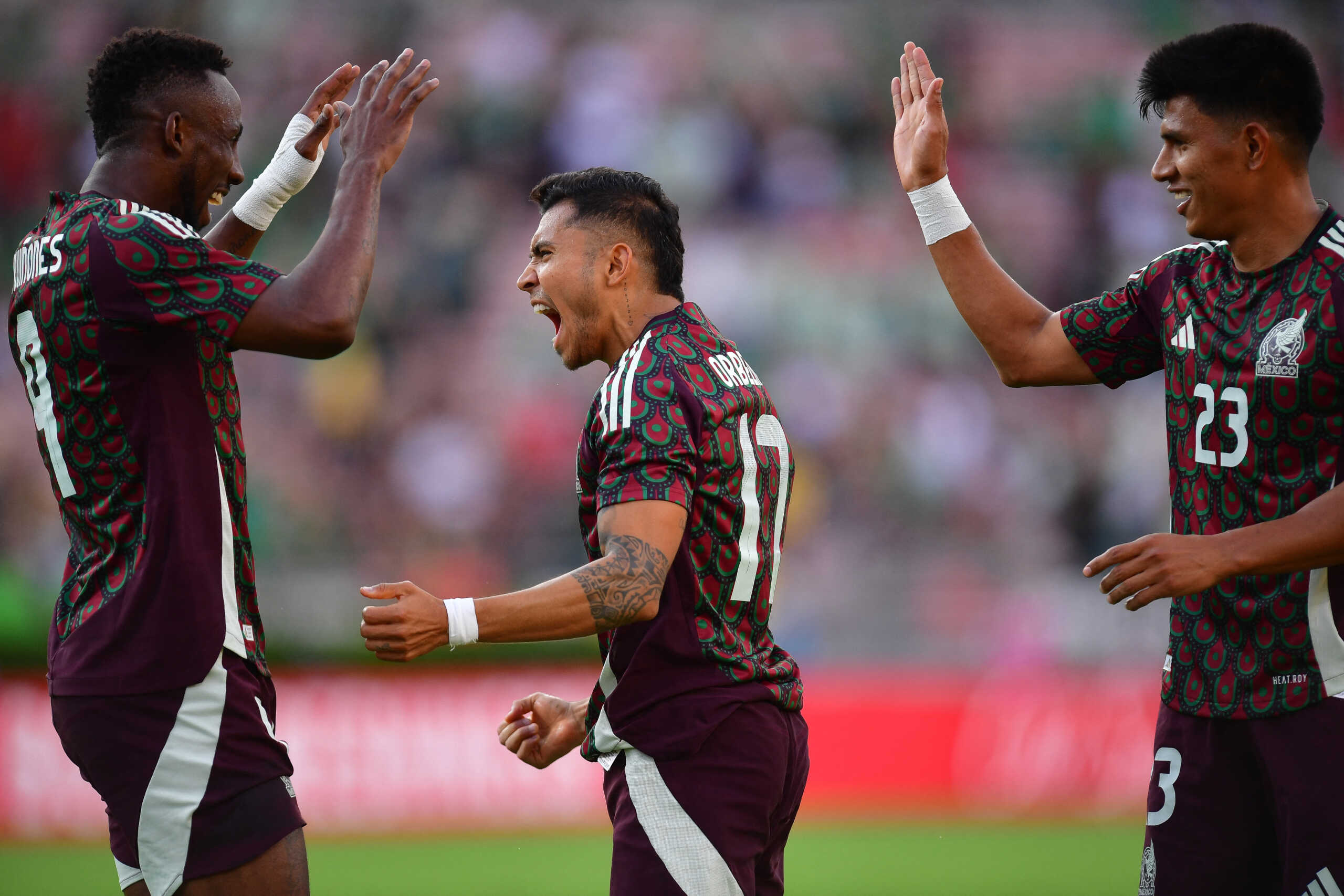 Sep 7, 2024; Pasadena, CA, USA; Mexico midfielder Orbelin Pineda (17) celebrates his goal scored against New Zealand with forward Julian Quinones (9) and midfielder Jesus Gallardo (23) during the first half at Rose Bowl. Mandatory Credit: Gary A. Vasquez-Imagn Images