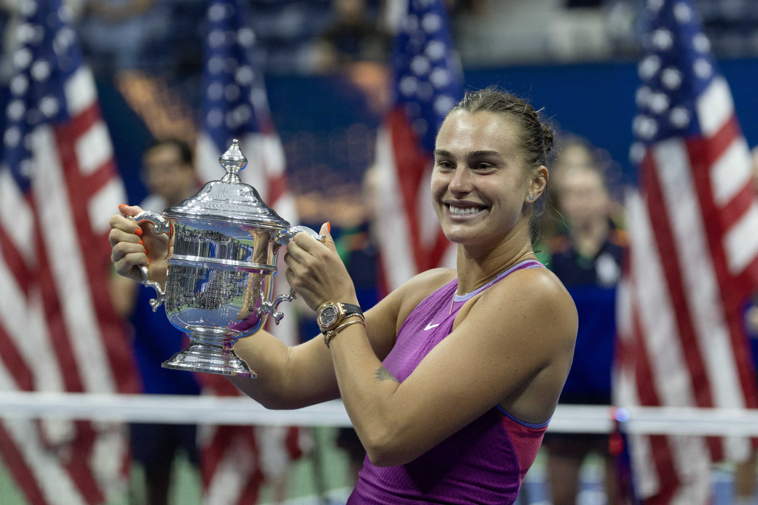 Sep 7, 2024; Flushing, NY, USA; Aryna Sabalenka celebrates with the championship trophy after her match against Jessica Pegula (USA) (not pictured) in the women's singles final of the 2024 U.S. Open tennis tournament at the USTA Billie Jean King National Tennis Center. Mandatory Credit: Mike Frey-Imagn Images