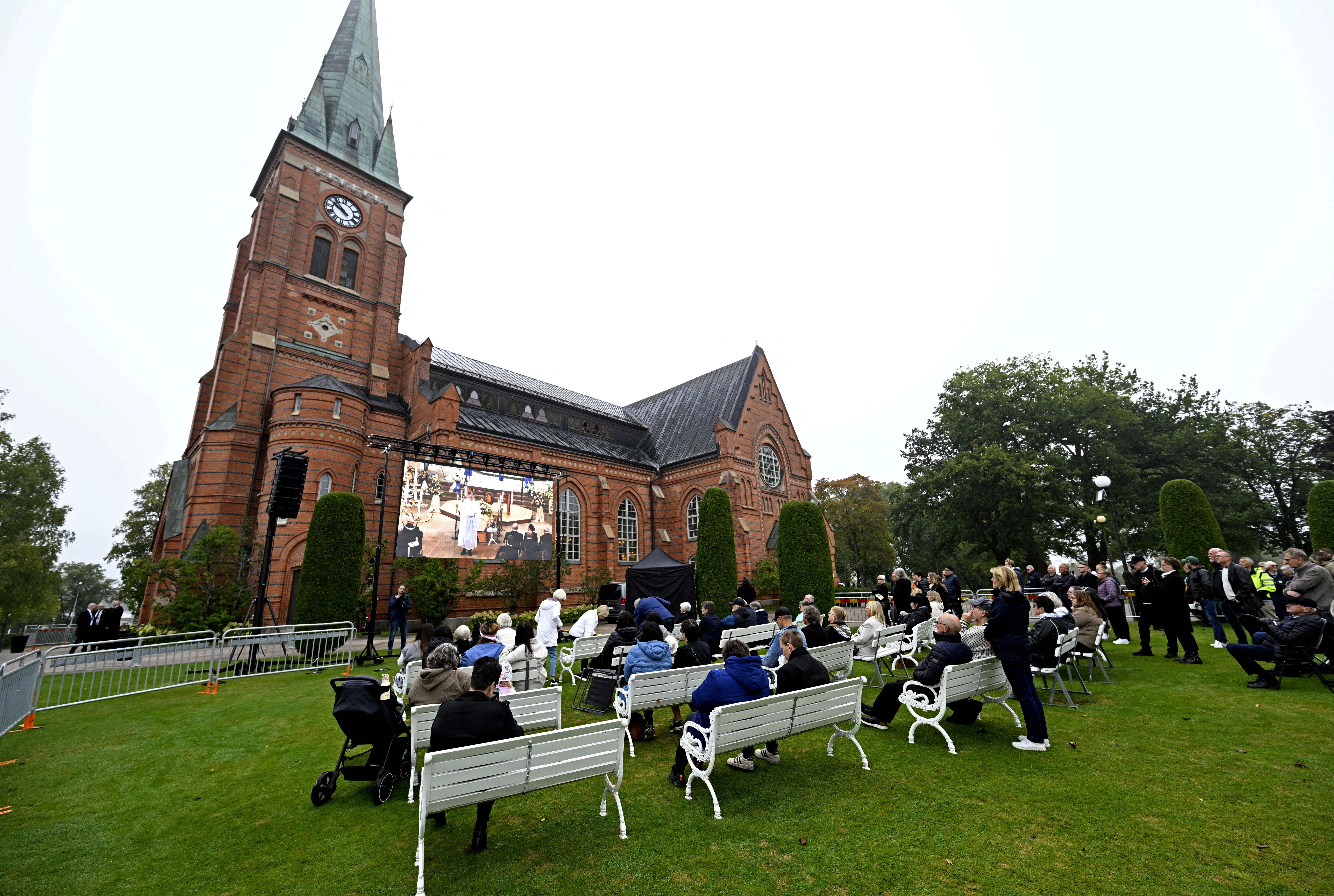 Soccer Football - Funeral of Sven-Goran Eriksson - Torsby, Sweden - September 13, 2024 People gather to watch a big screen outside Fryksande church during the funeral service for Sven-Goran Eriksson Tommy Pedersen