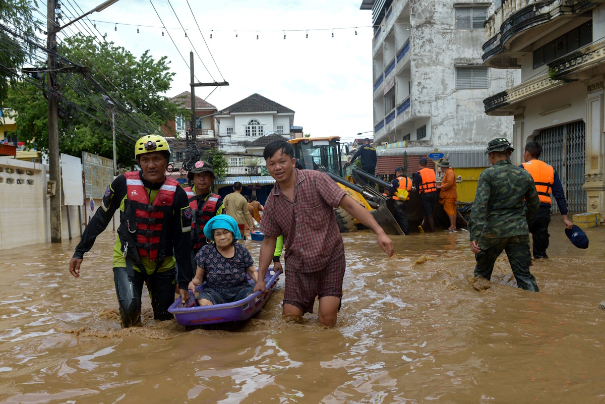 Rescue workers help a stranded woman from a flooded area at the border town of Mae Sai, following the impact of Typhoon Yagi, in the northern province of Chiang Rai, Thailand, September 12, 2024. REUTERS