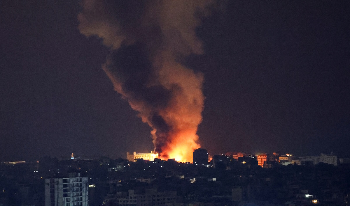 Smoke and flames rise over Beirut's southern suburbs after a strike, amid ongoing hostilities between Hezbollah and Israeli forces, as seen from Sin El Fil, Lebanon, October 5, 2024. REUTERS