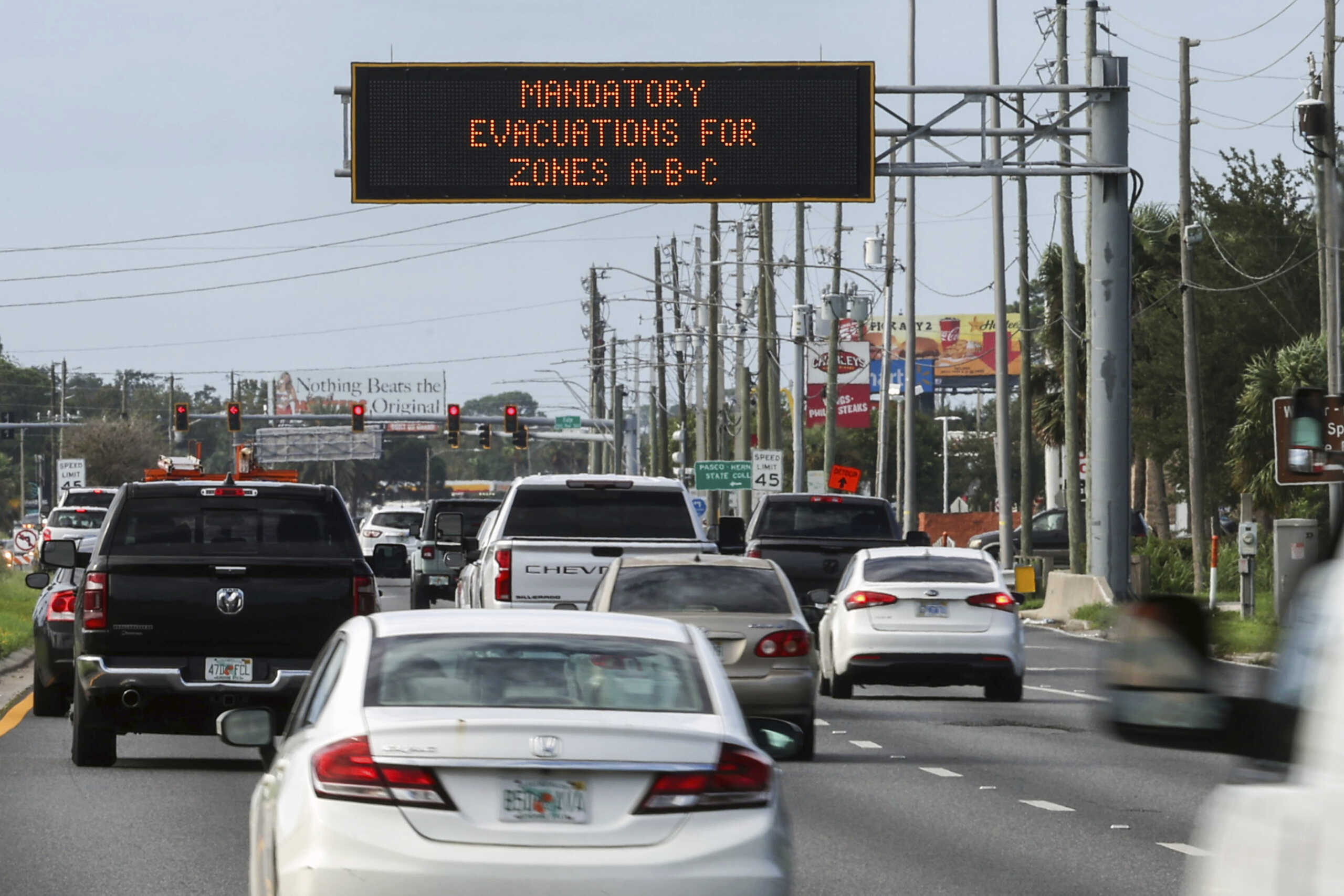 Highway signage announces the impending arrival of Hurricane Milton and the evacuations zones on Tuesday, Oct. 8, 2024, in Port Richey, Fla. (AP Photo