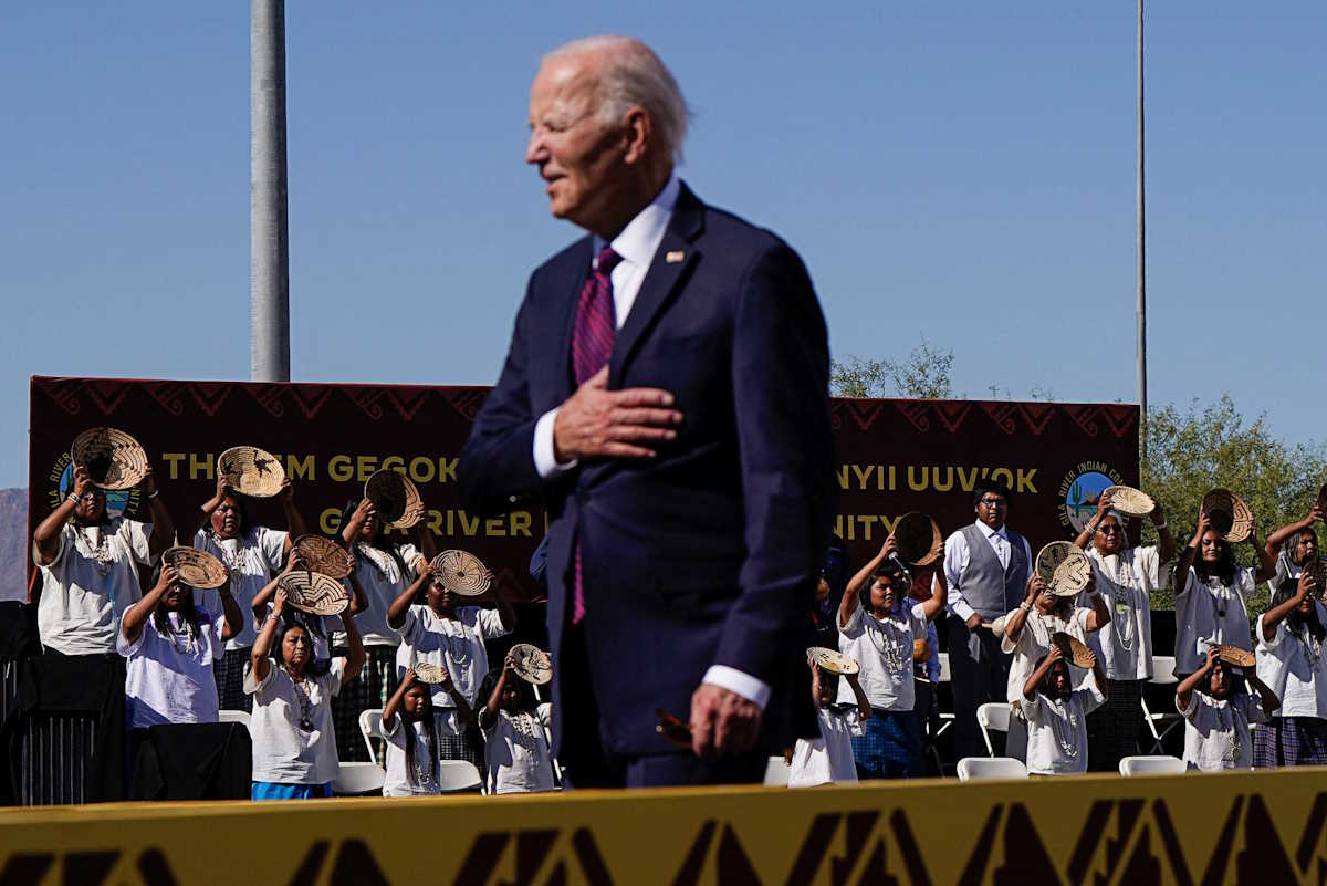 U.S. President Joe Biden gestures during a performance, at Gila Crossing Community School in Gila River Indian Community, Arizona, U.S., October 25, 2024. REUTERS