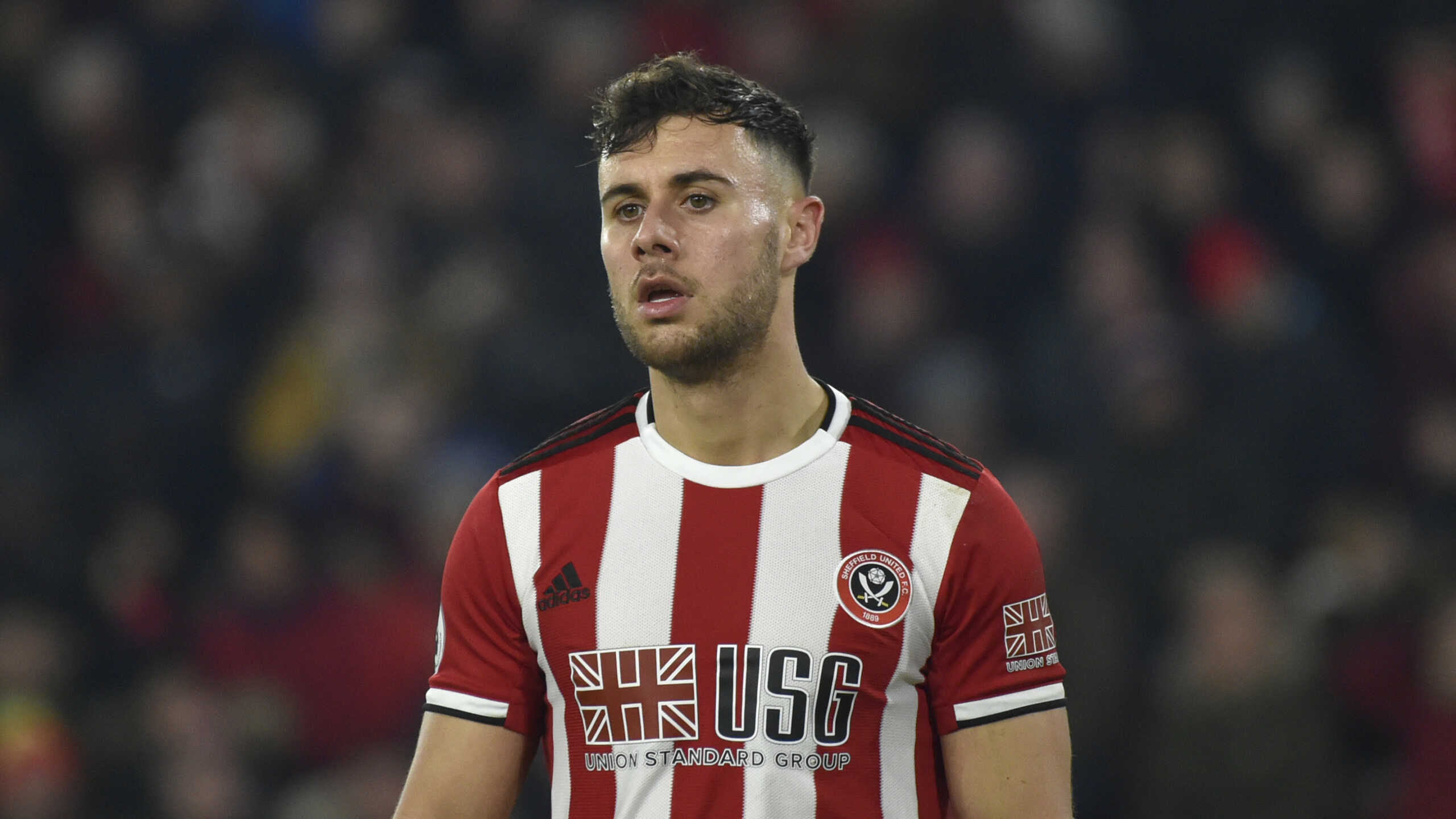 Sheffield United's George Baldock during the English Premier League soccer match between Sheffield United and Manchester City at Bramall Lane in Sheffield, England, Tuesday, Jan. 21, 2020. (AP Photo