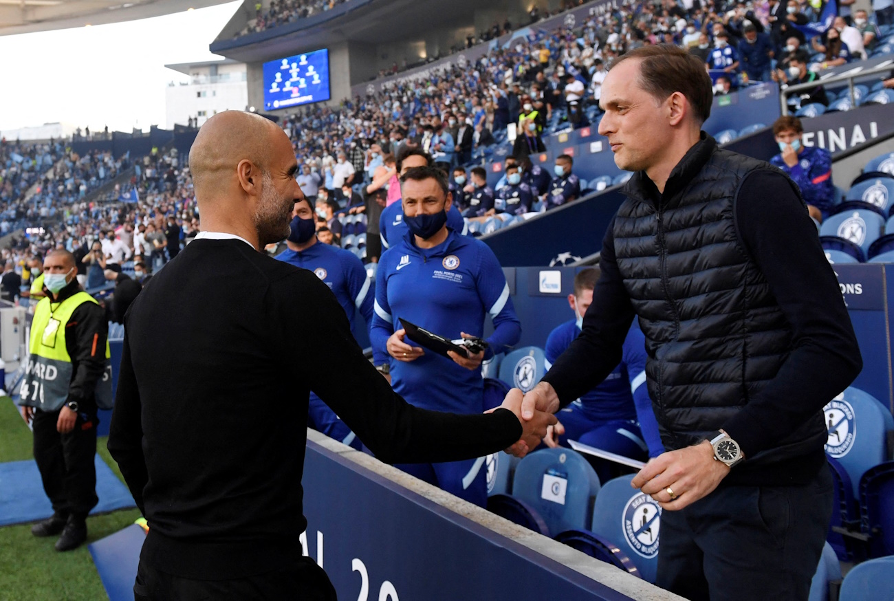 FILE PHOTO: Soccer Football - Champions League Final - Manchester City v Chelsea - Estadio do Dragao, Porto, Portugal - May 29, 2021 Manchester City manager Pep Guardiola with Chelsea manager Thomas Tuchel before the match Pool via REUTERS