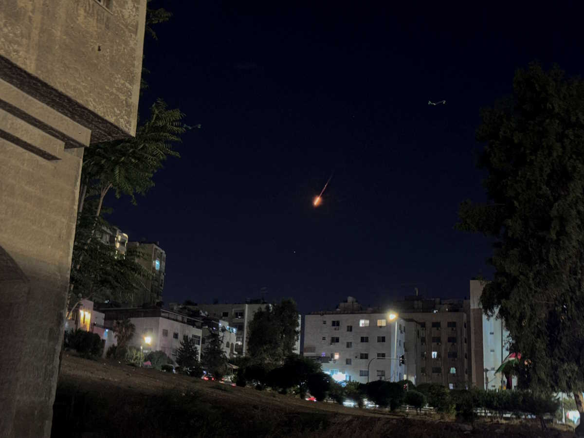 Projectile flies in the sky over Jordan after Iran fired a salvo of ballistic missiles at Israel, as seen from Amman, Jordan October 1, 2024. REUTERS