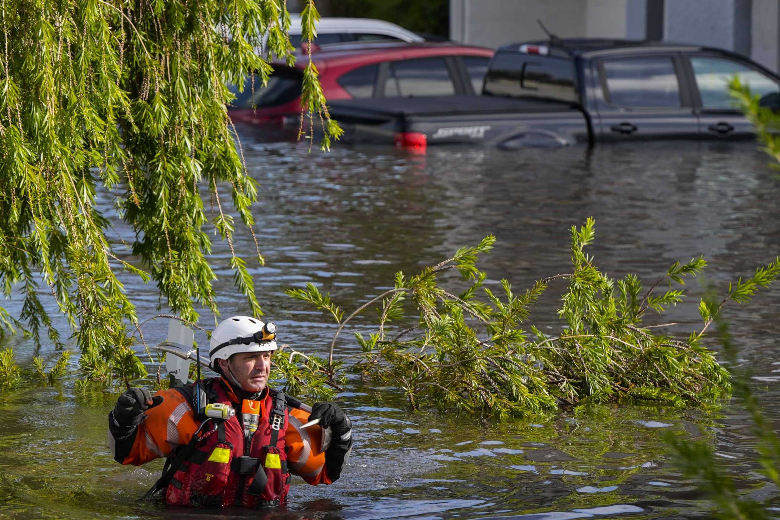 A water rescue team member walks through flood waters at an apartment complex in the aftermath of Hurricane Milton, Thursday, Oct. 10, 2024, in Clearwater, Fla. (AP Photo