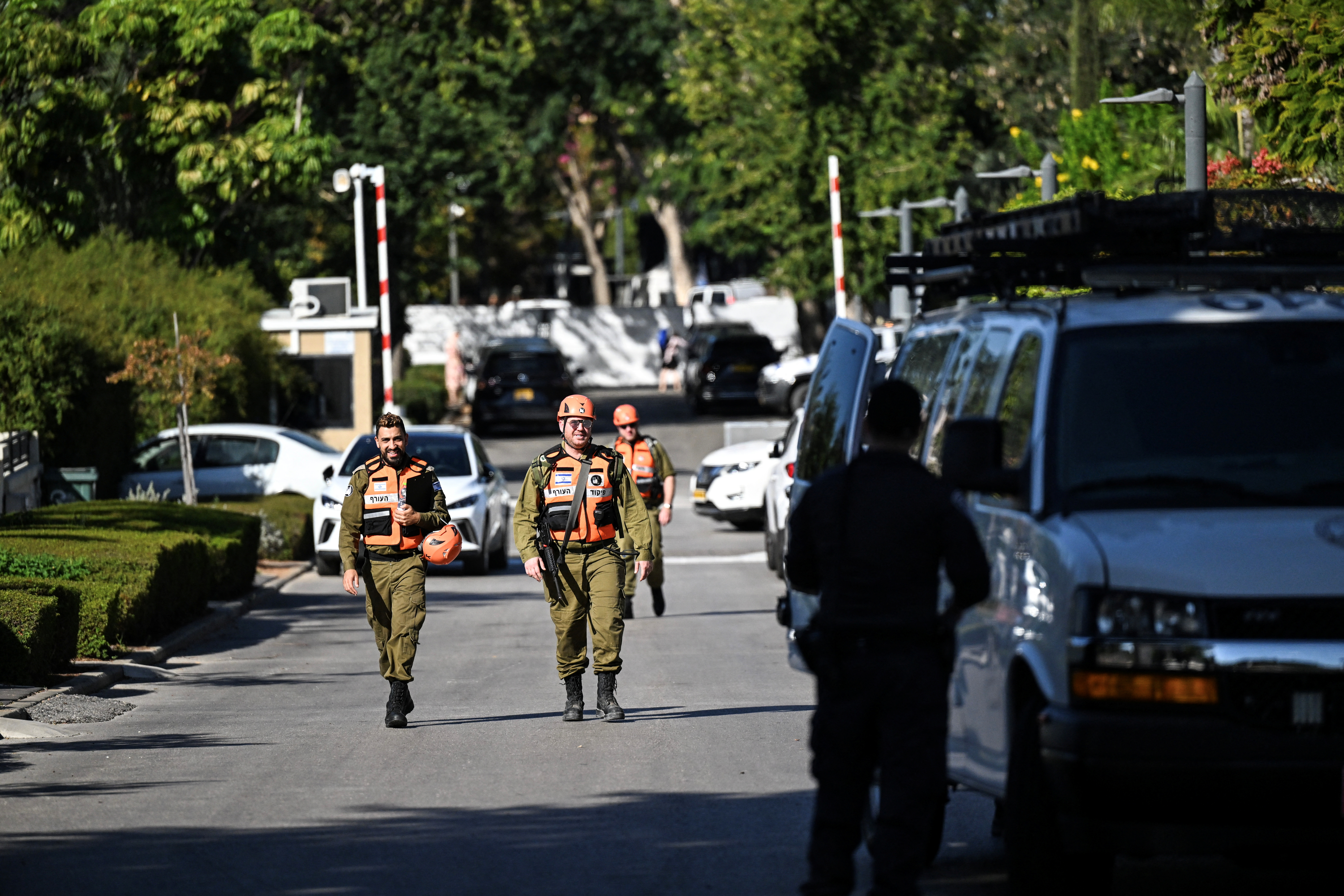 Israeli Home Front Command soldiers walk down a street in Caesarea, Israel, October 19, 2024 following a drone attack from Lebanon towards Israel amid ongoing hostilities between Hezbollah and Israel. REUTERS