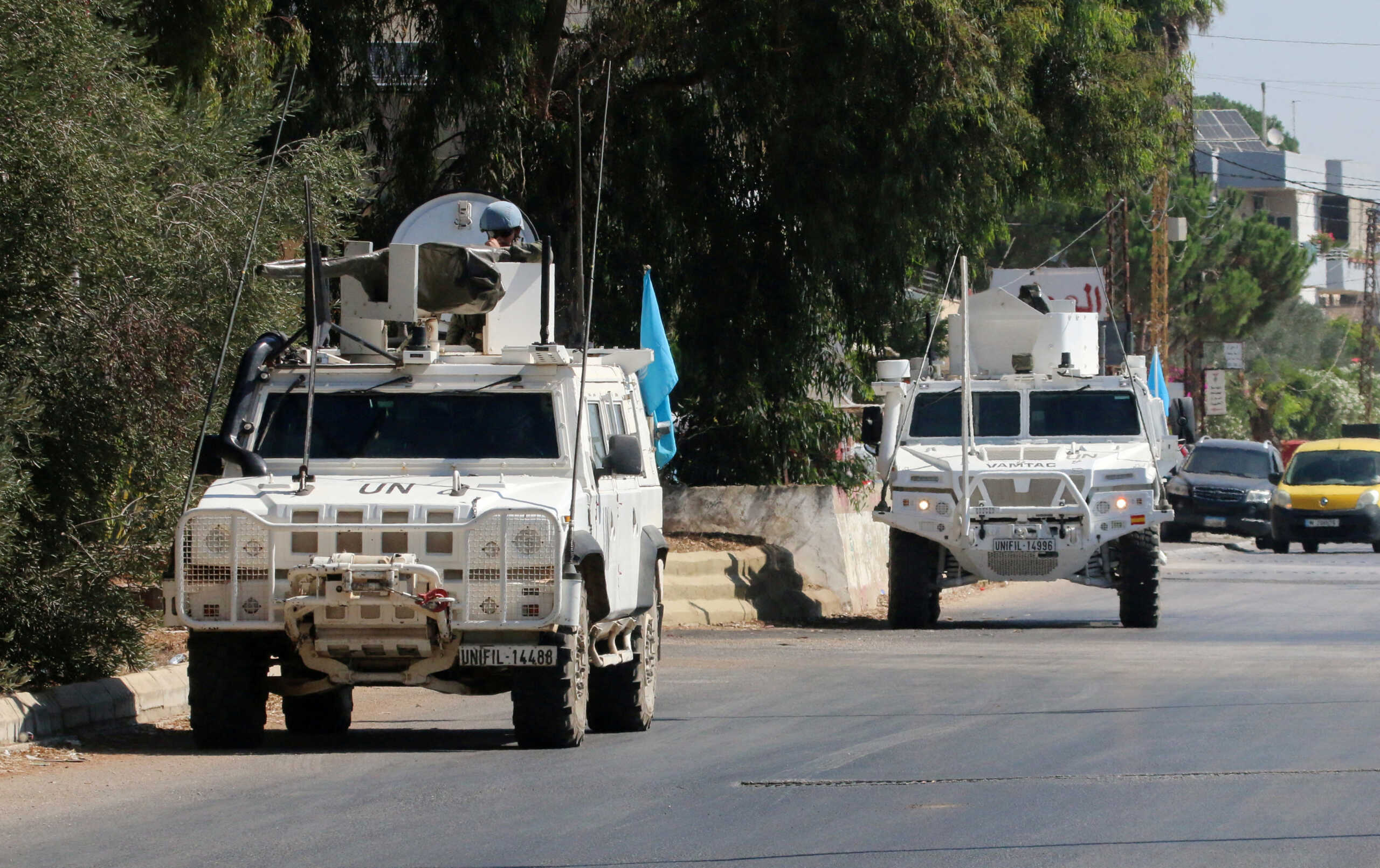 FILE PHOTO: UN peacekeepers (UNIFIL) vehicles are seen parked in Marjayoun, near the border with Israel, in southern Lebanon August 9, 2024. REUTERS