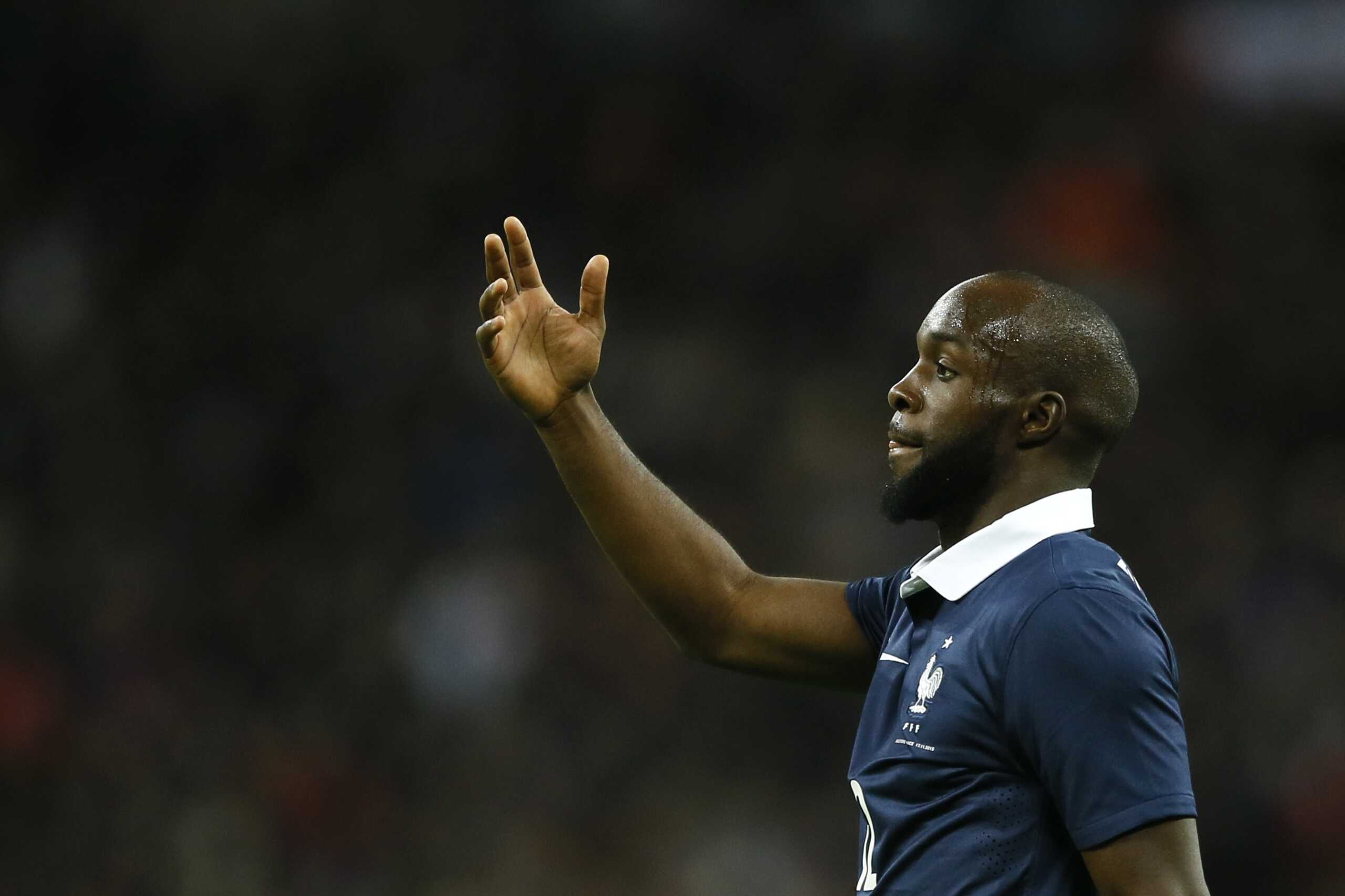 France's Lassana Diarra, whose cousin was killed in the Paris attacks, during the international friendly soccer match between England and France at Wembley Stadium in London, Tuesday, Nov. 17, 2015. France is playing England at Wembley on Tuesday after the countries decided the match should go ahead despite the deadly attacks in Paris last Friday night which killed scores of people. (AP Photo