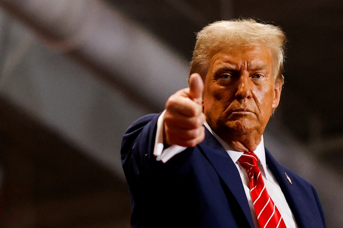 Republican presidential nominee and former U.S. President Donald Trump gestures at a campaign rally in Rocky Mount, North Carolina, U.S., October 30, 2024. REUTERS