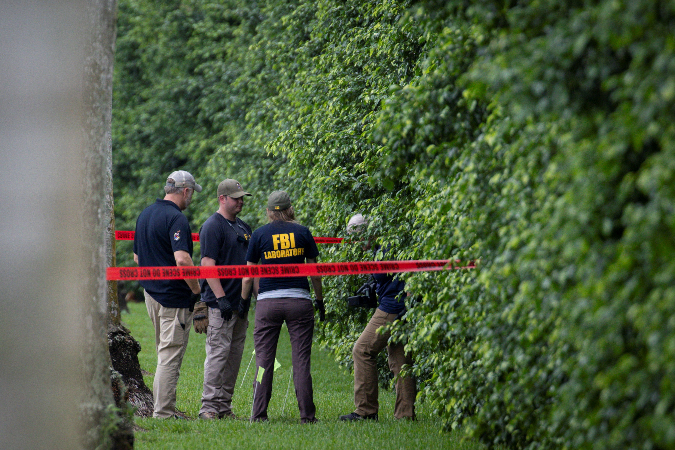 FBI officers work on the perimeter of Trump International Golf Club, following an apparent assassination attempt on Republican presidential nominee and former U.S. President Donald Trump, after a gunman was found at the Trump's golf course, in West Palm Beach, Florida, U.S. September 17, 2024.  REUTERS