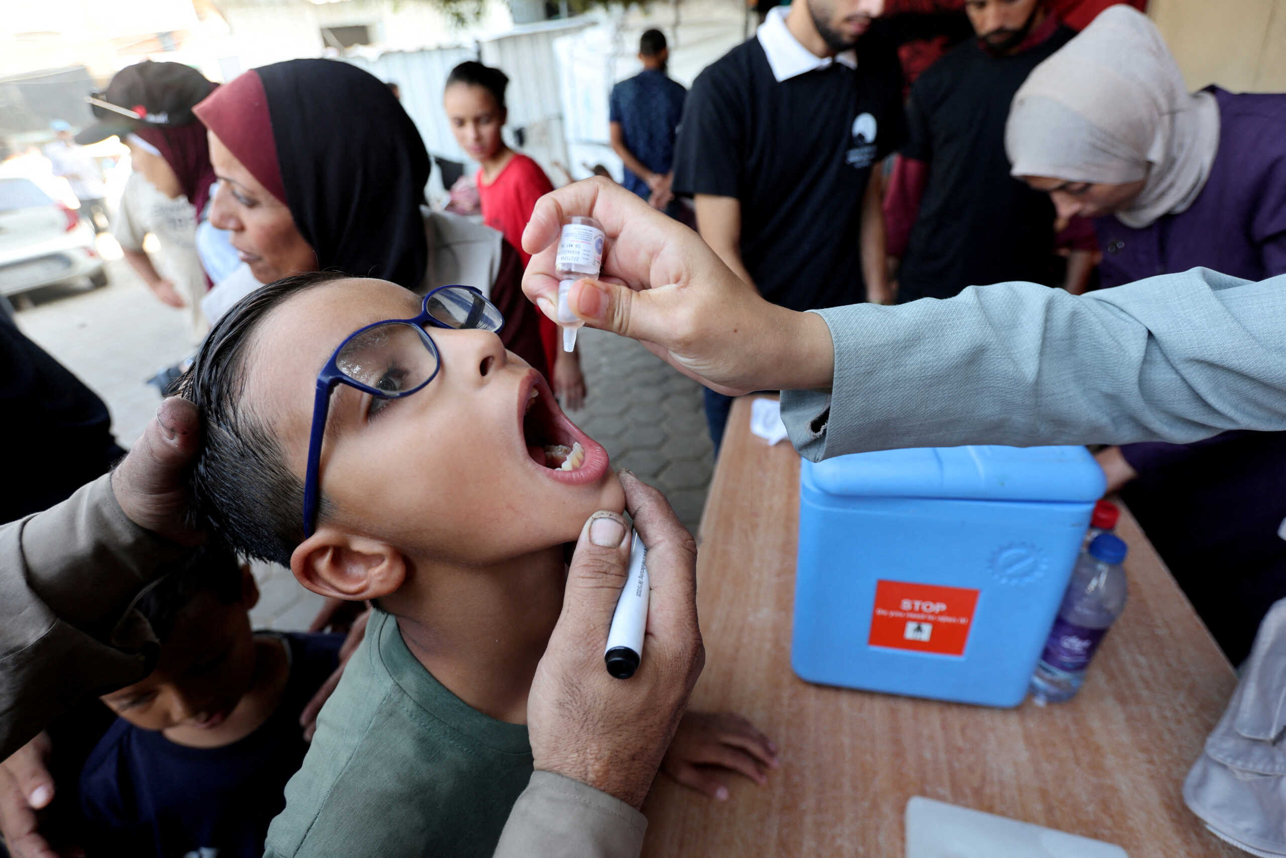 FILE PHOTO: Palestinian child is vaccinated against polio during the second round of a vaccination campaign, amid the Israel-Hamas conflict, in Deir Al-Balah in the central Gaza Strip, October 14, 2024. REUTERS