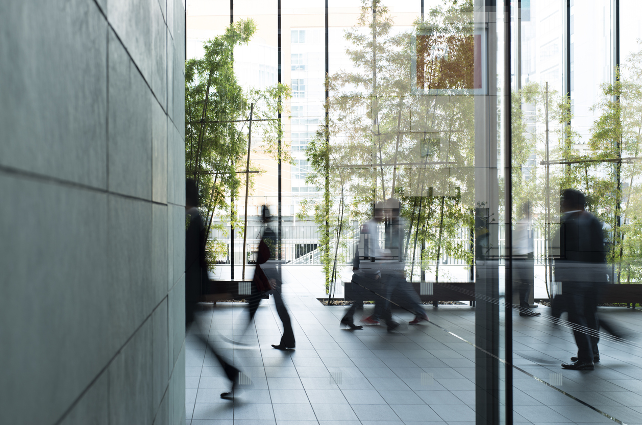 Business person walking in a urban building