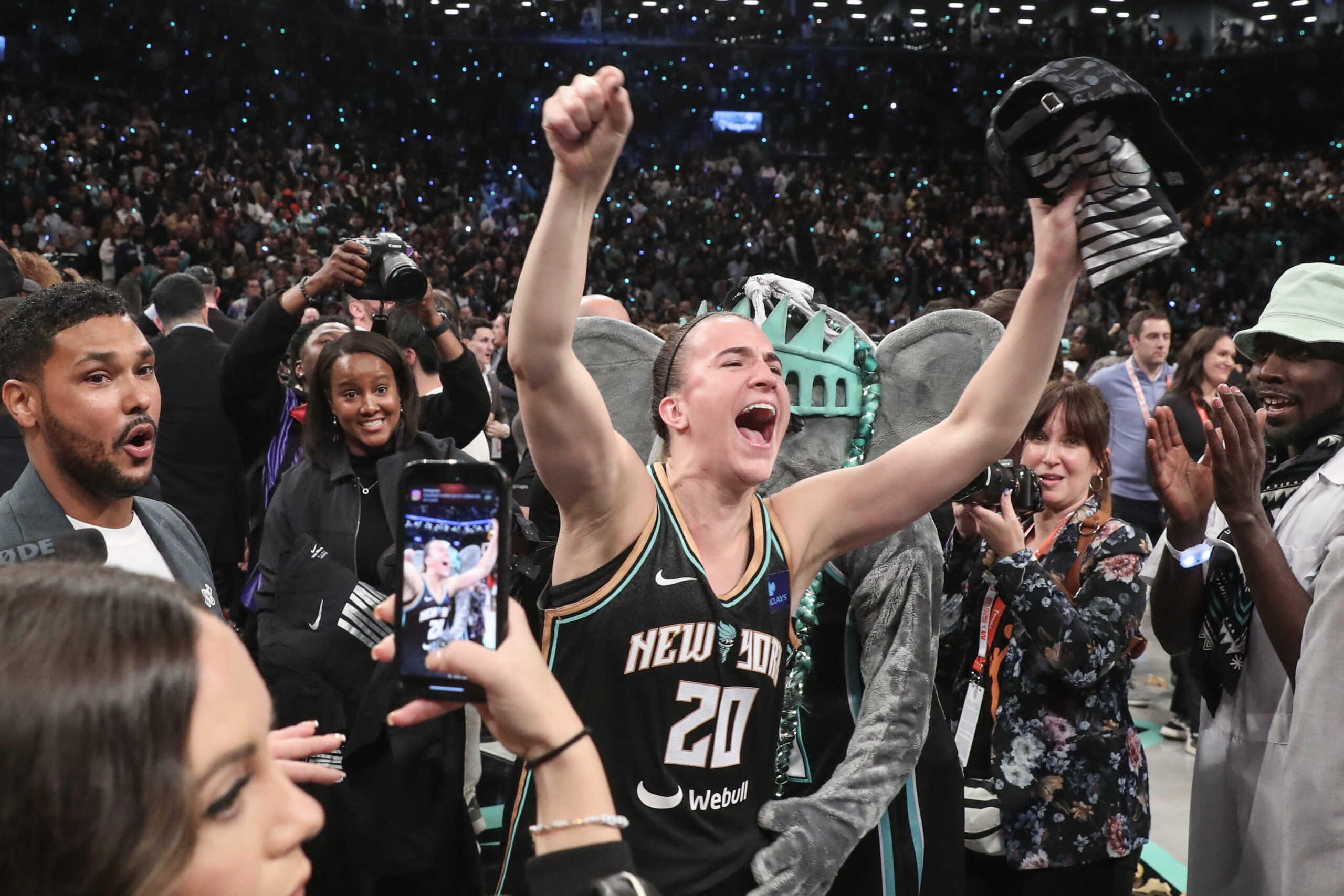 Oct 20, 2024; Brooklyn, New York, USA; New York Liberty guard Sabrina Ionescu (20) celebrates after defeating the Minnesota Lynx in overtime to win the 2024 WNBA Finals at Barclays Center. Mandatory Credit: Wendell Cruz-Imagn Images