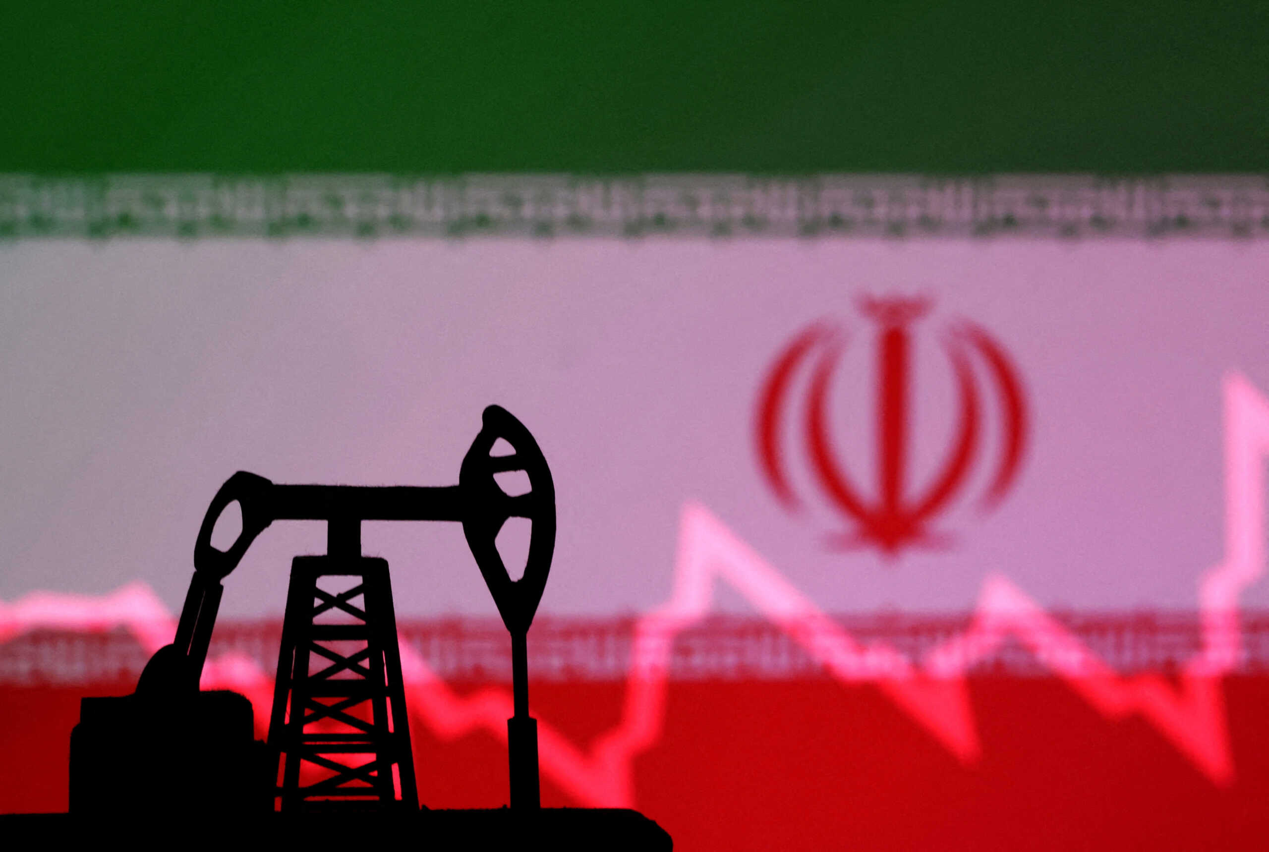 FILE PHOTO: Iranian flag with stock graph and an oil pump jack miniature model are seen in this illustration taken October 9, 2023. REUTERS