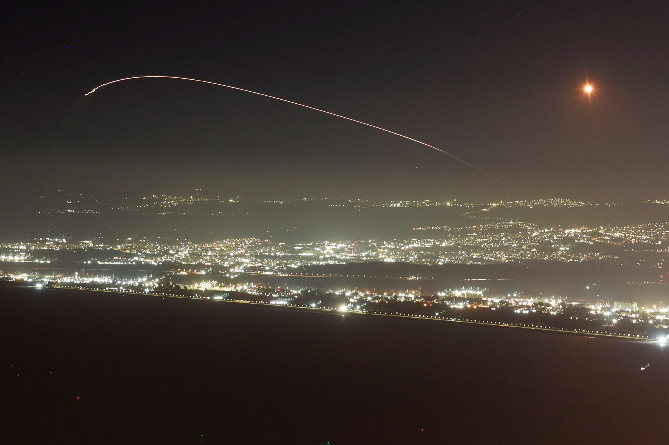 Israel's Iron Dome anti-missile system operates for interceptions as rockets are launched from Lebanon towards Israel, amid hostilities between Hezbollah and Israel, as seen from Haifa, Israel, October 3, 2024. REUTERS