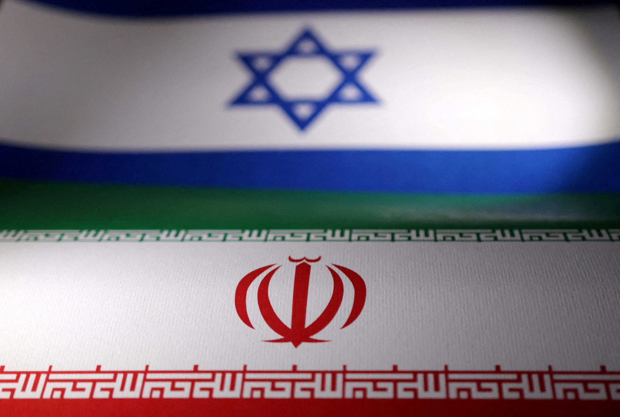 FILE PHOTO: Israeli and Iranian flags are seen in this illustration taken, April 24, 2024. REUTERS