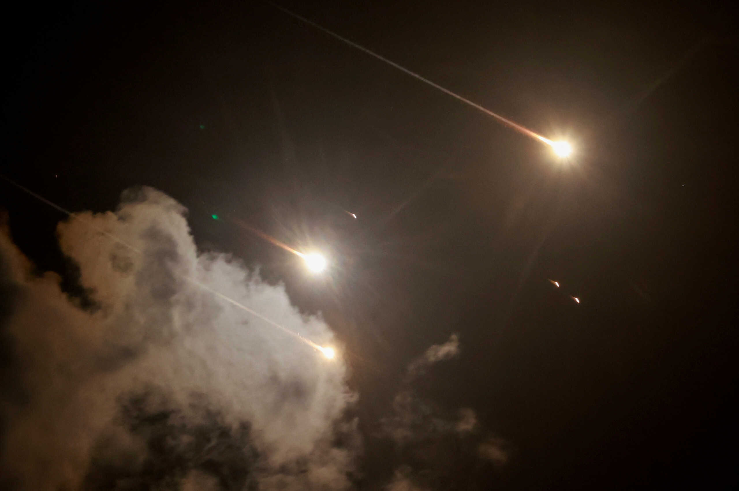 FILE PHOTO: Projectiles are seen in the sky after Iran fired a salvo of ballistic missiles, amid cross-border hostilities between Hezbollah and Israel, as seen from Tel Aviv, Israel, October 1, 2024. REUTERS