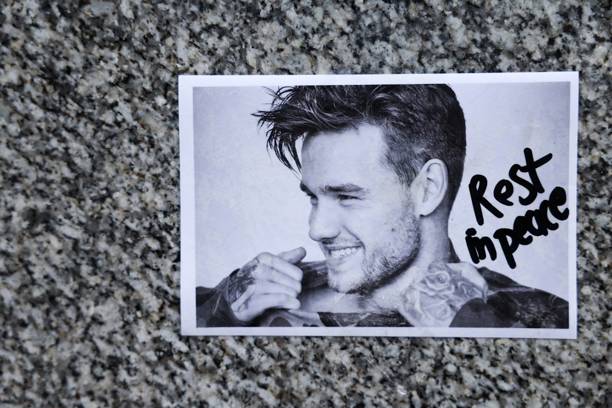 A picture of One Direction singer Liam Payne, who was found dead after he fell from a third-floor hotel room balcony in Buenos Aires, lies outside St. Peter’s collegiate church in Wolverhampton, Britain, October 20, 2024. REUTERS