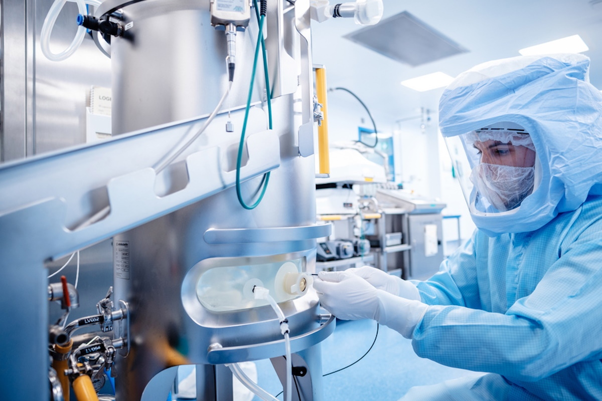 epa09000801 A handout photo made available by German pharmaceuticals company BioNTech shows an employee at work in the facility for the mRNA prouction in the Biontech factory in Marburg, Germany, 20 January 2021 (issued 10 February 2021). According to a press release issued on 10 February 2021, BioNTech started at the Marburg facility the production of mRNA, the active pharmaceutical ingredient of the Pfizer-BioNTech COVID-19 vaccine.  EPA