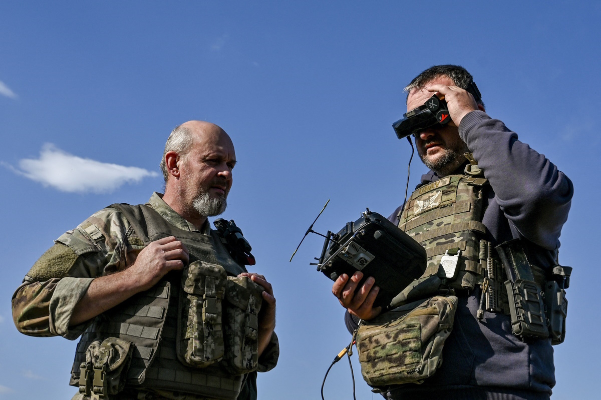 Ukrainian servicemen of the 'Bulava' Unmanned Aerial Vehicles Unit of the Separate Presidential Brigade prepare to make a test fly with an FPV drone with an attached portable grenade launcher at their position near a frontline, amid Russia's attack on Ukraine, in Zaporizhzhia region, Ukraine October 11, 2024. REUTERS