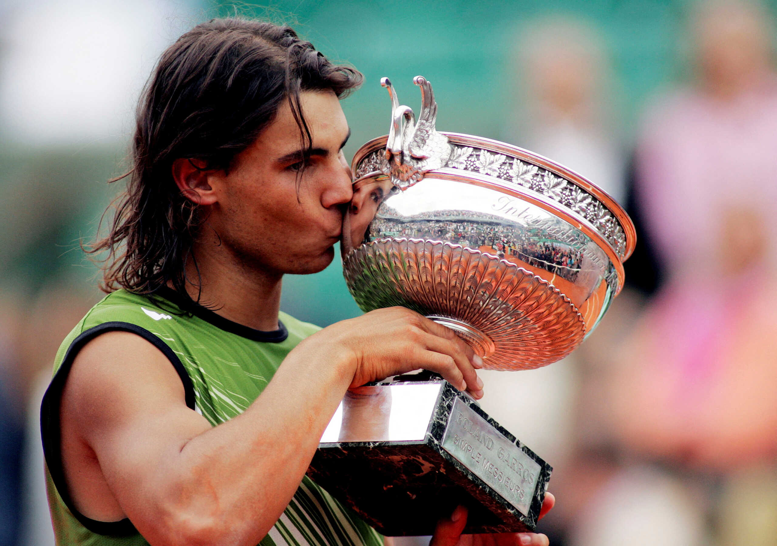 FILE PHOTO: Tennis - French Open - Stade Roland Garros - June 5, 2005 Spain's Rafael Nadal celebrates winning the French open with the trophy  Action Images via Reuters