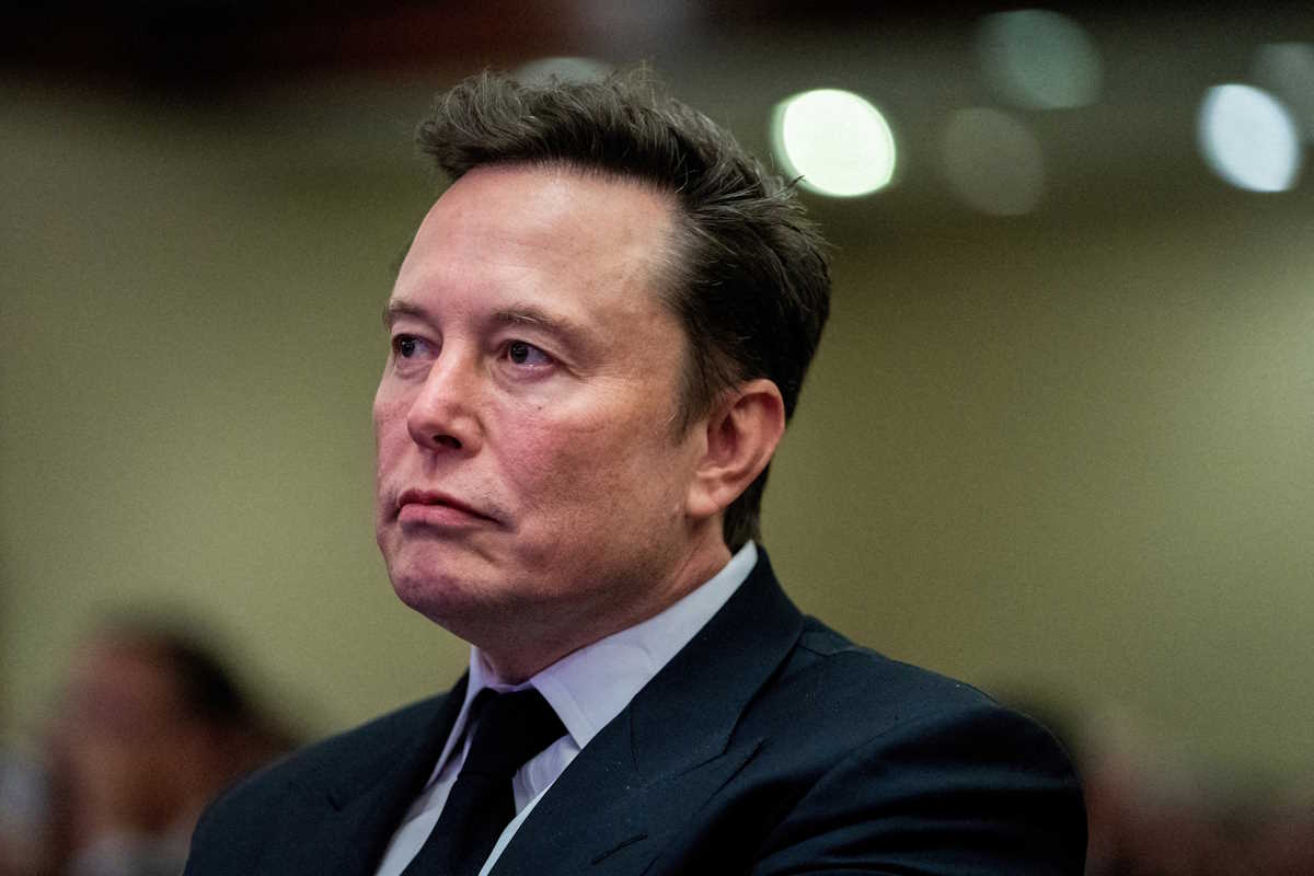 FILE PHOTO: Tesla CEO and X owner Elon Musk listens as US President-elect Donald Trump speaks during a meeting with House Republicans at the Hyatt Regency hotel in Washington, DC, U.S. on November 13, 2024.  ALLISON ROBBERT