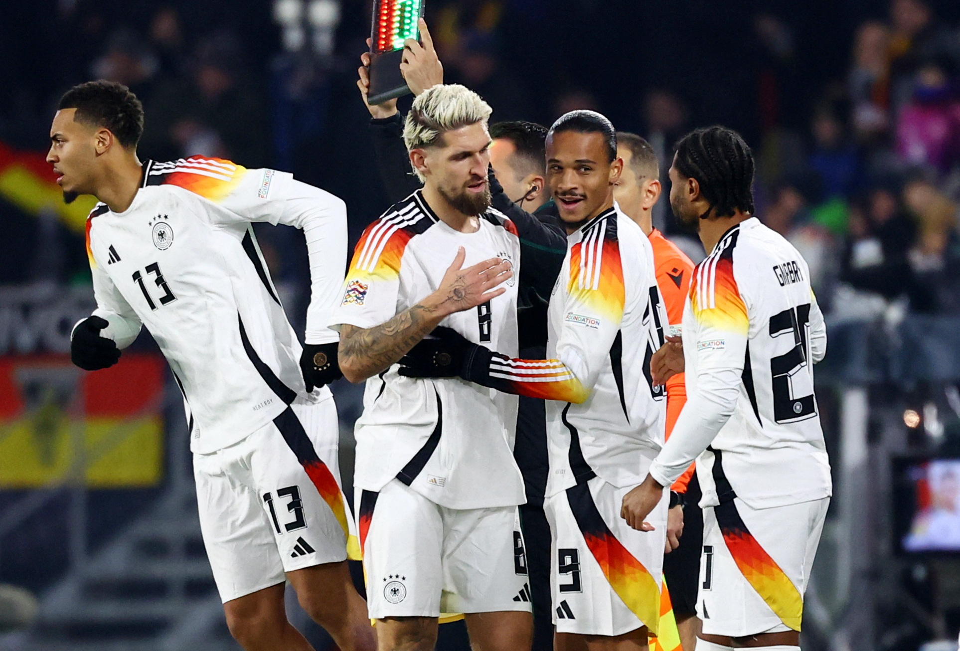 Soccer Football - Nations League - Group Stage - Germany v Bosnia and Herzegovina - Europa Park Stadion, Freiburg, Germany - November 16, 2024 Germany's Leroy Sane and Serge Gnabry get ready to come on as substitutes as Robert Andrich comes off REUTERS