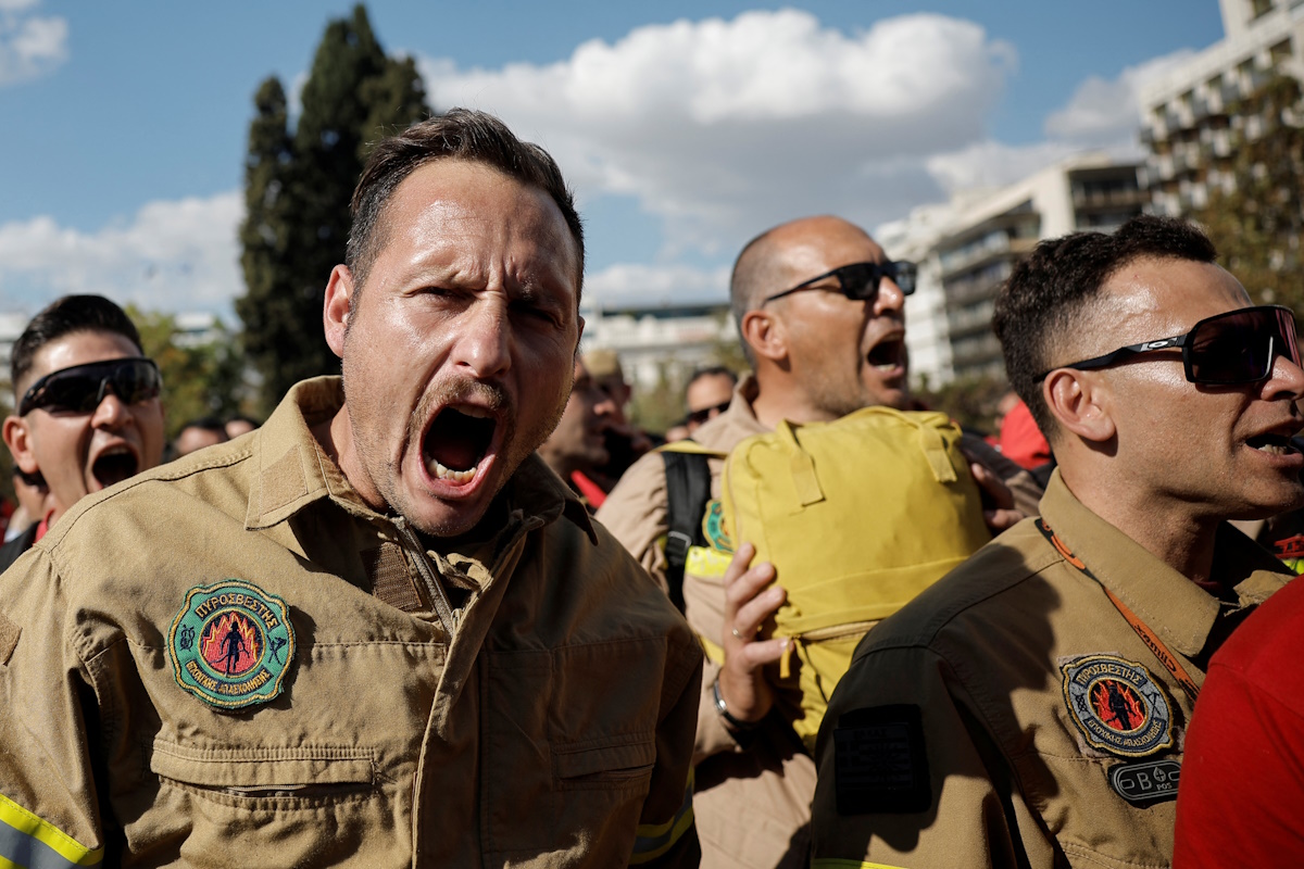 Greek seasonal firefighters protest near the Greek parliament to demand permanent jobs, after their short-term contracts expired as a dire wildfire season came to an end, in Athens, Greece, November 1, 2024.  REUTERS