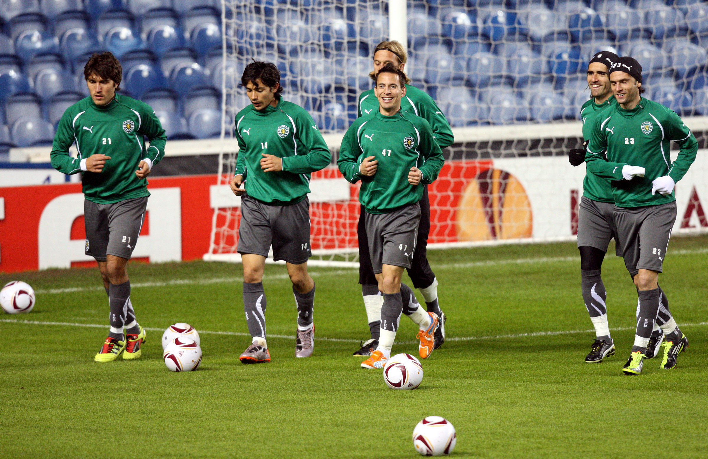 Sporting Lisbon's Joao Pereira, center, is seen with his teammates during their training session at Ibrox, Glasgow, Scotland, Wednesday Feb. 16, 2011. Sporting Lisbon will play Rangers in a Europa League round of 32 first leg soccer match on Thursday. (AP Photo