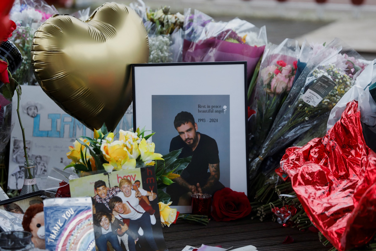 Flowers and tributes are placed at the bandstand in West Park to remember former One Direction singer Liam Payne, in Wolverhampton, Britain November 8, 2024. REUTERS