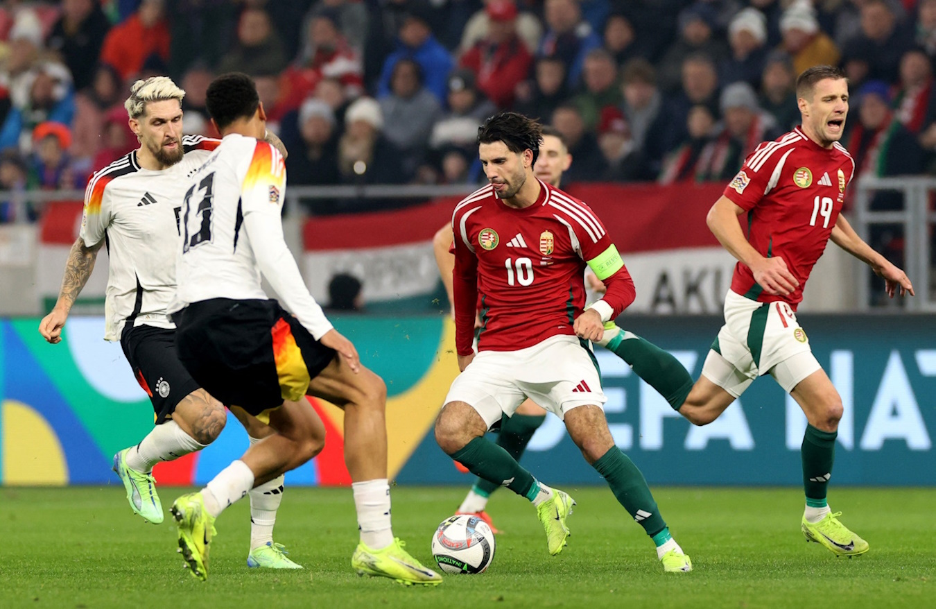 Soccer Football - UEFA Nations League - Group Stage - Hungary v Germany - Puskas Arena Park, Budapest, Hungary - November 19, 2024  Germany's Robert Andrich in action with Hungary's Dominik Szoboszlai and Hungary's Barnabas Varga REUTERS