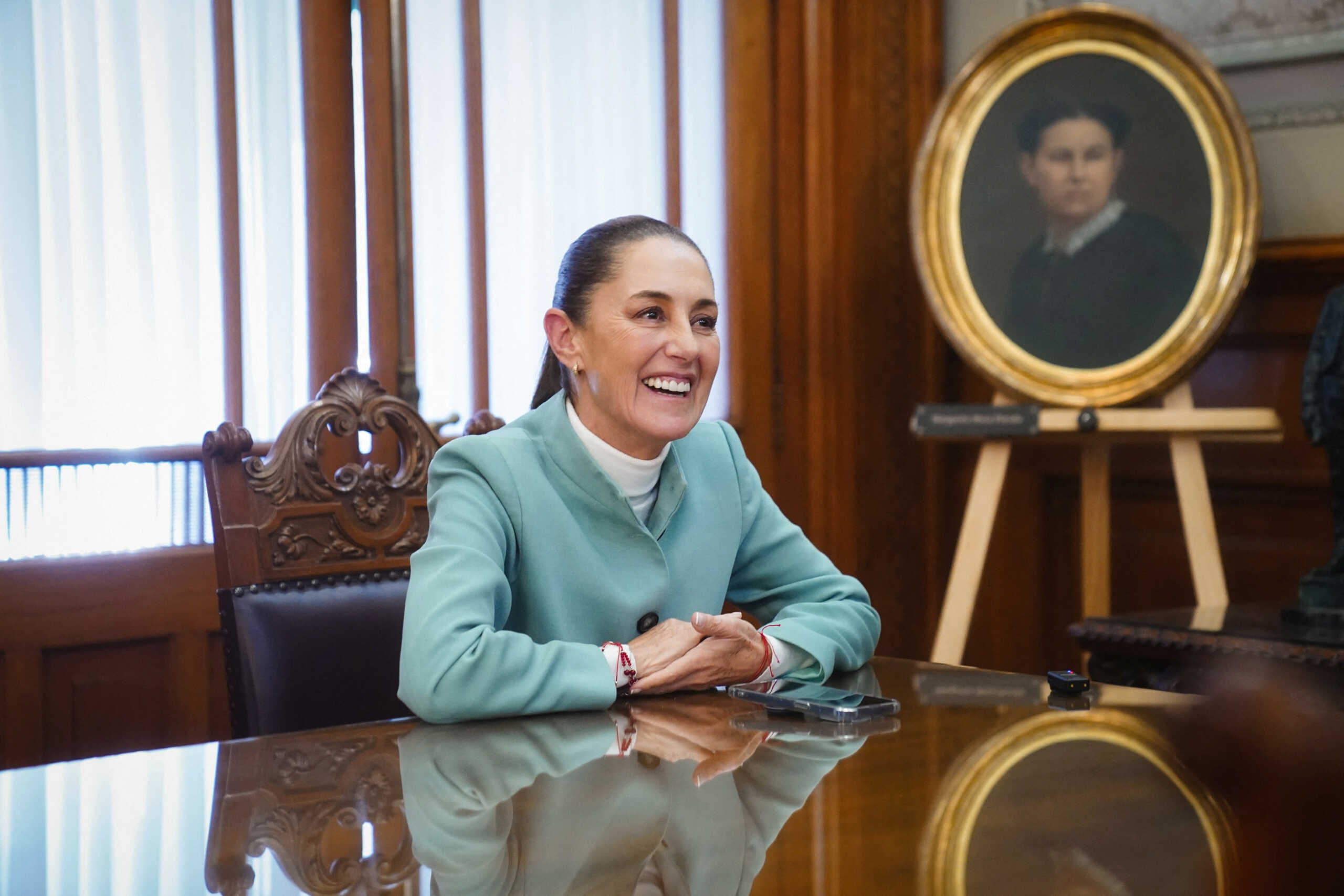 Mexican President Claudia Sheinbaum speaks on the phone with Uruguay's President-elect Yamandu Orsi in this handout photo released November 25, 2024.     Claudia Sheinbaum via X