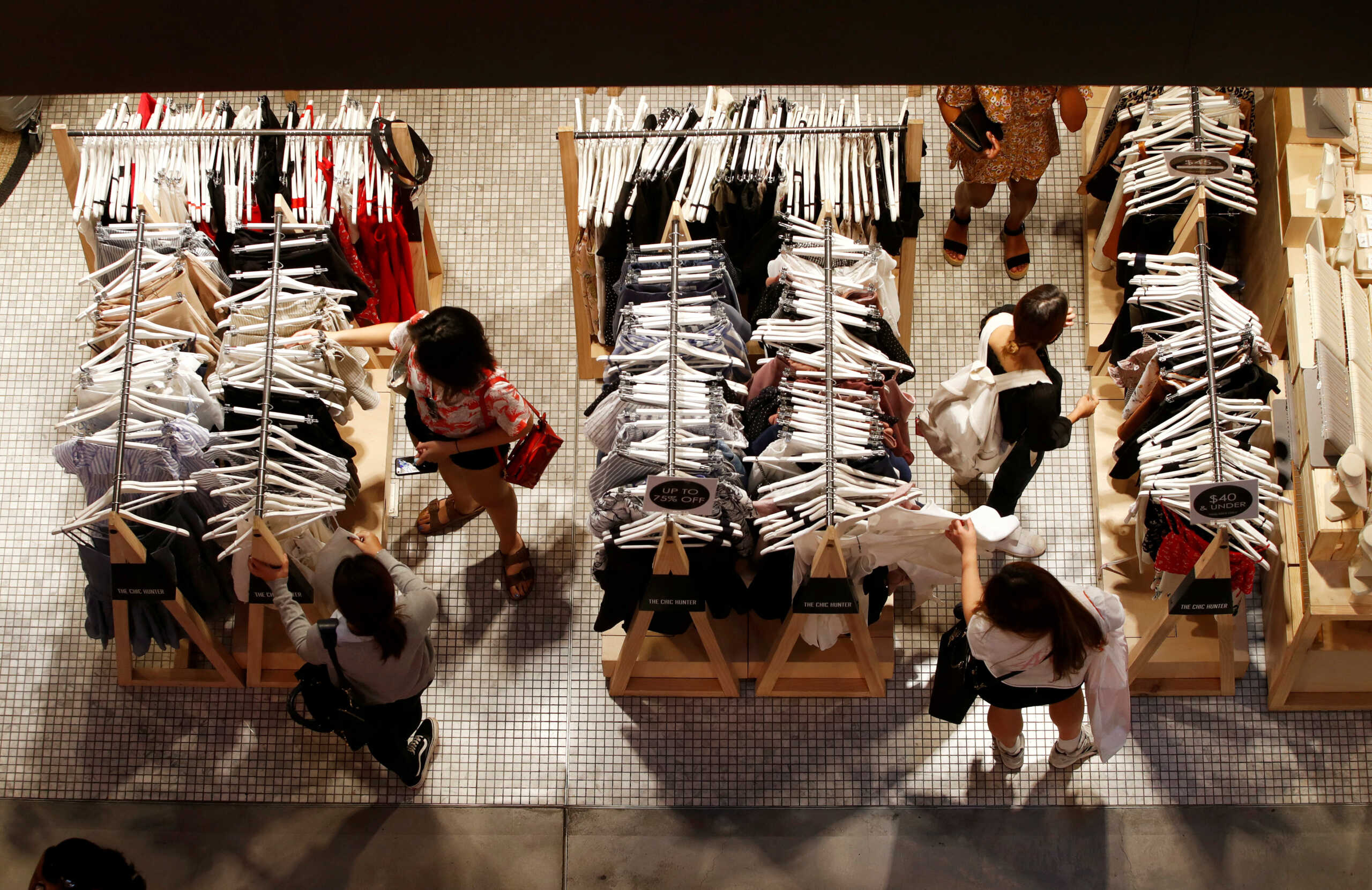 FILE PHOTO: Women shop for clothes on a store in a shopping mall in Sydney's central business district (CBD) Australia, February 5, 2018. Picture taken February 5, 2018. REUTERS