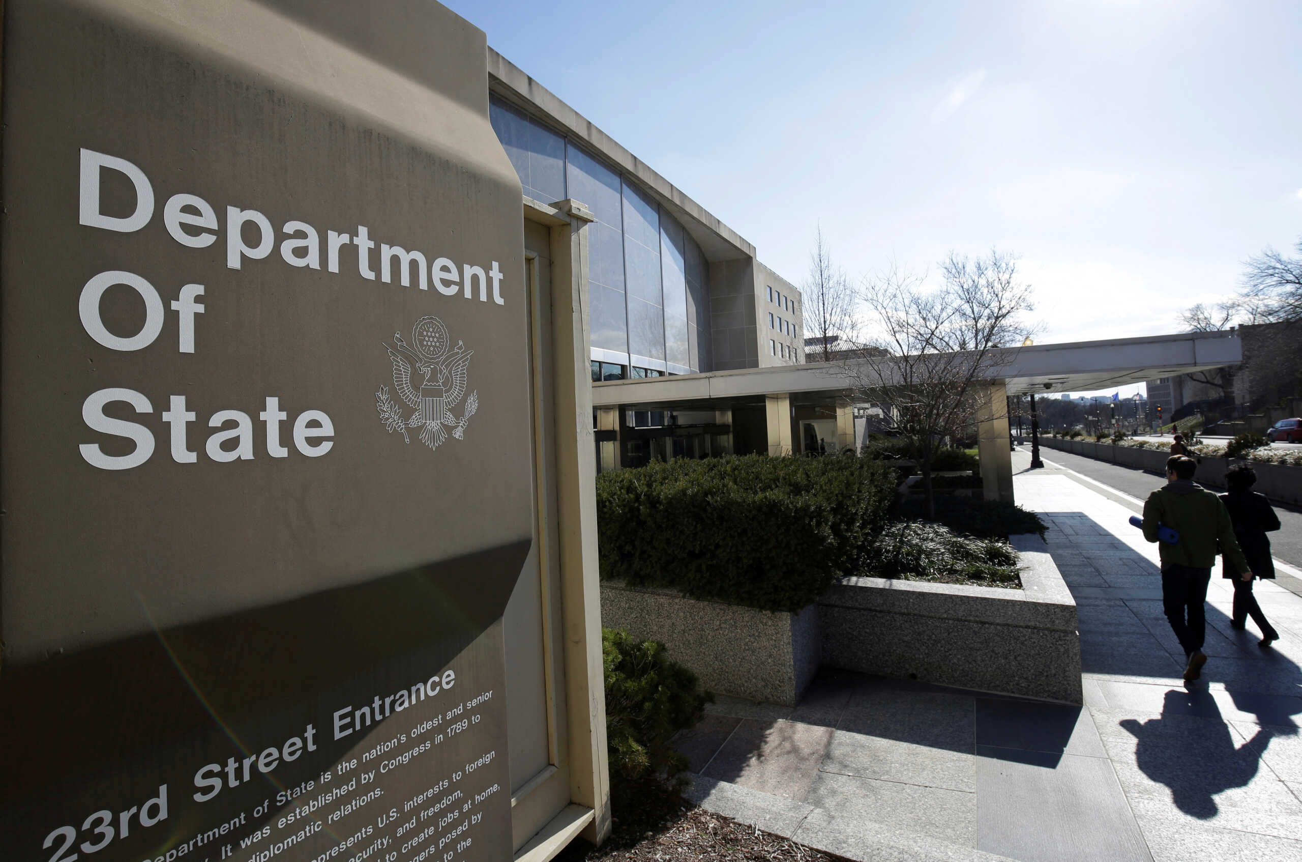 FILE PHOTO: People enter the State Department Building in Washington, U.S., January 26, 2017. REUTERS