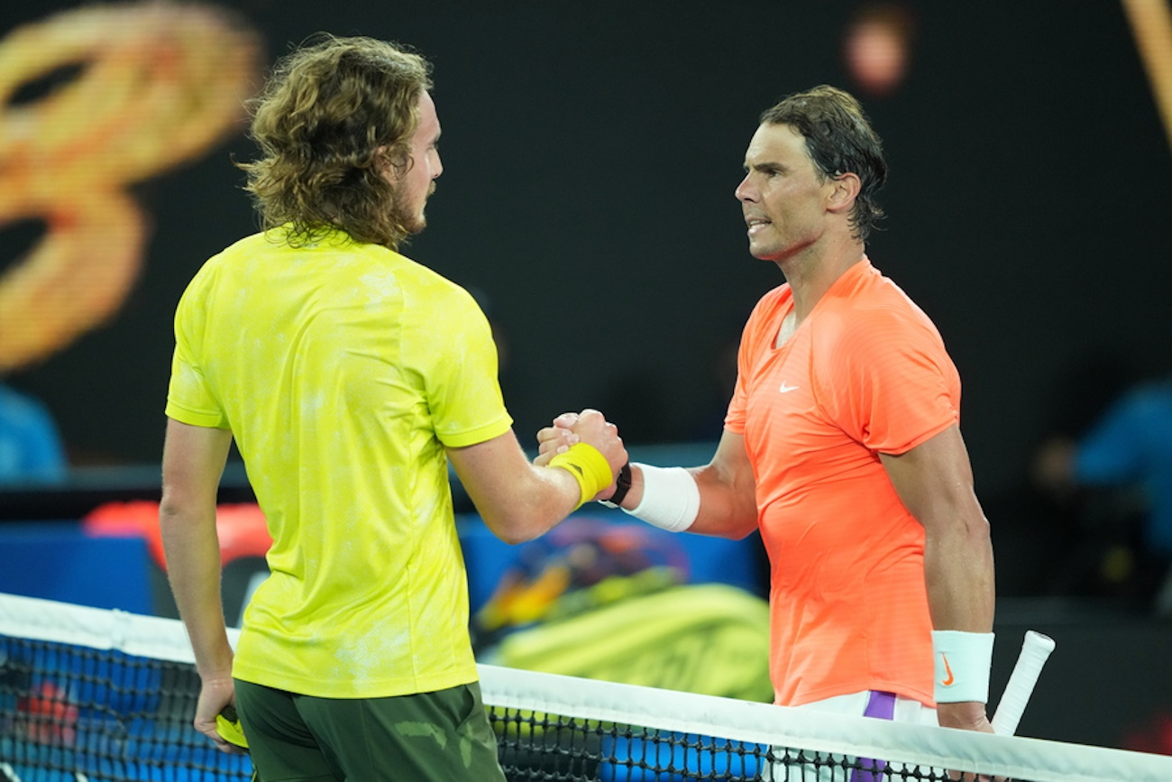 epa09018372 Stefanos Tsitsipas (L) of Greece shakes hand with Rafael Nadal of Spain after defeating him in their Men's singles quarter finals match on Day 10 of the Australian Open at Melbourne Park in Melbourne, Australia, 17 February 2021.  EPA