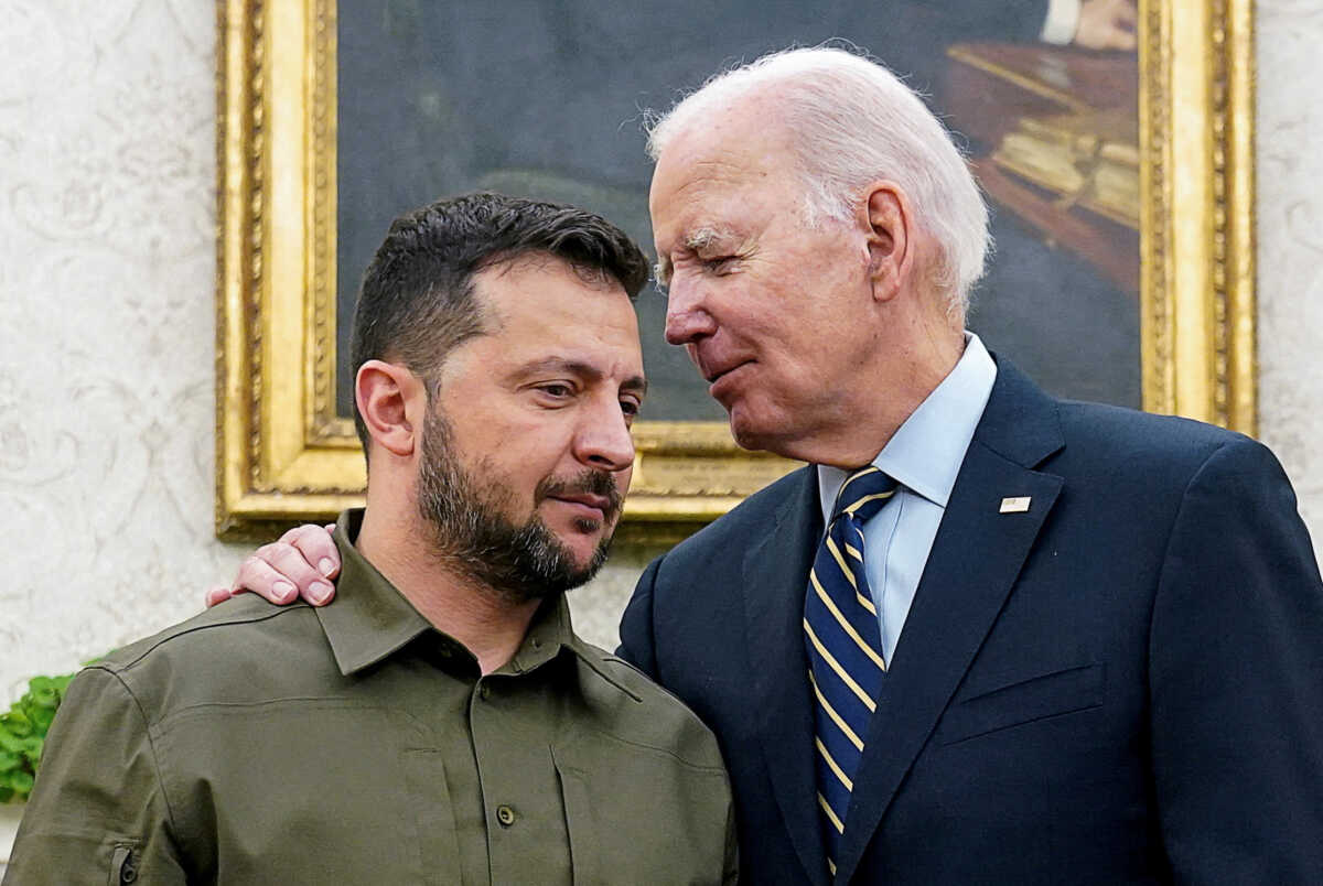 FILE PHOTO: Ukrainian President Volodymyr Zelenskiy is embraced by U.S. President Joe Biden in the Oval Office of the White House in Washington, September 21, 2023. REUTERS