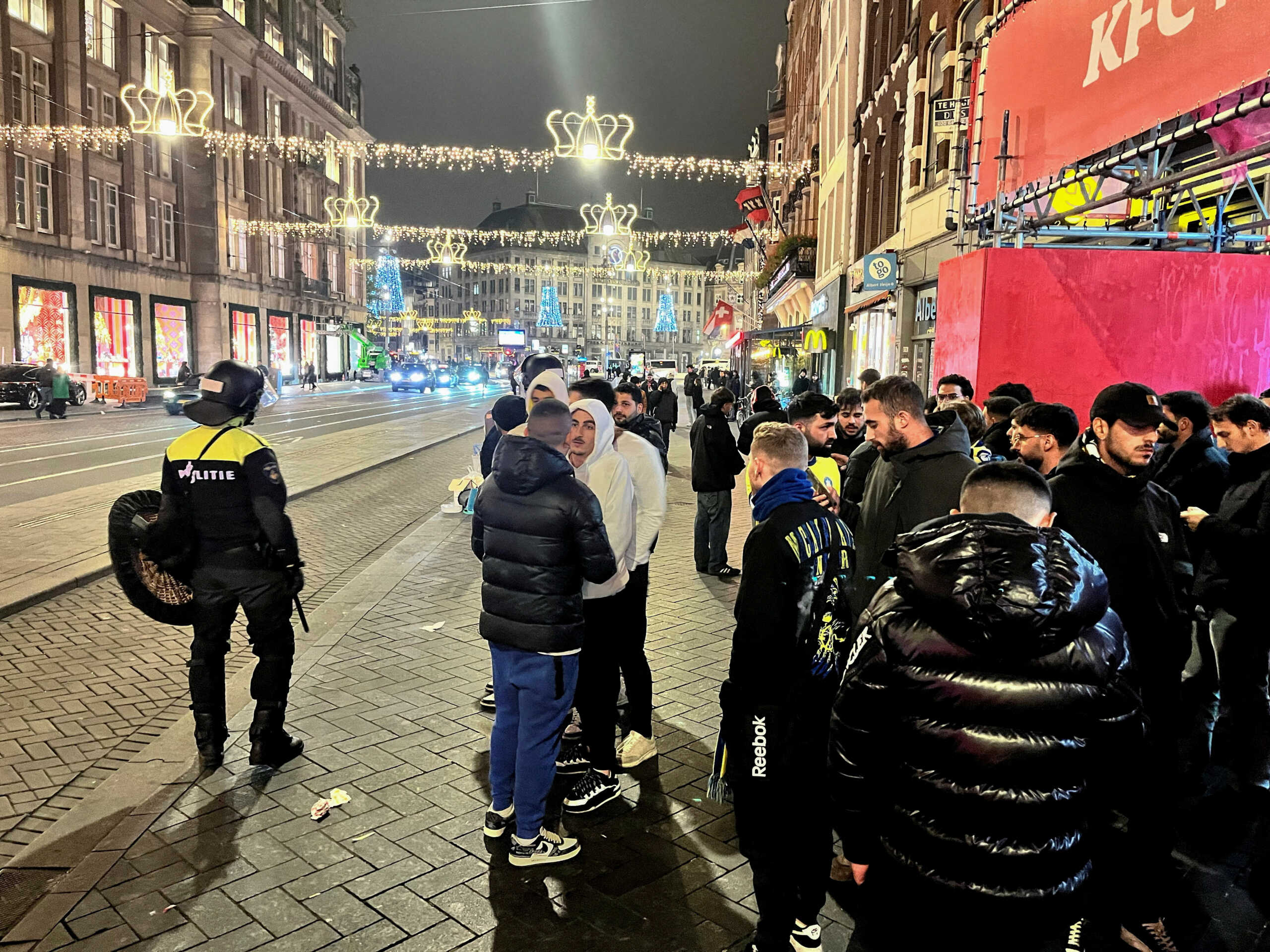 Israeli Maccabi Tel Aviv supporters are guarded by police after violence targeting Israeli football fans broke out in Amsterdam overnight, in Amsterdam, Netherlands, November 8, 2024. REUTERS